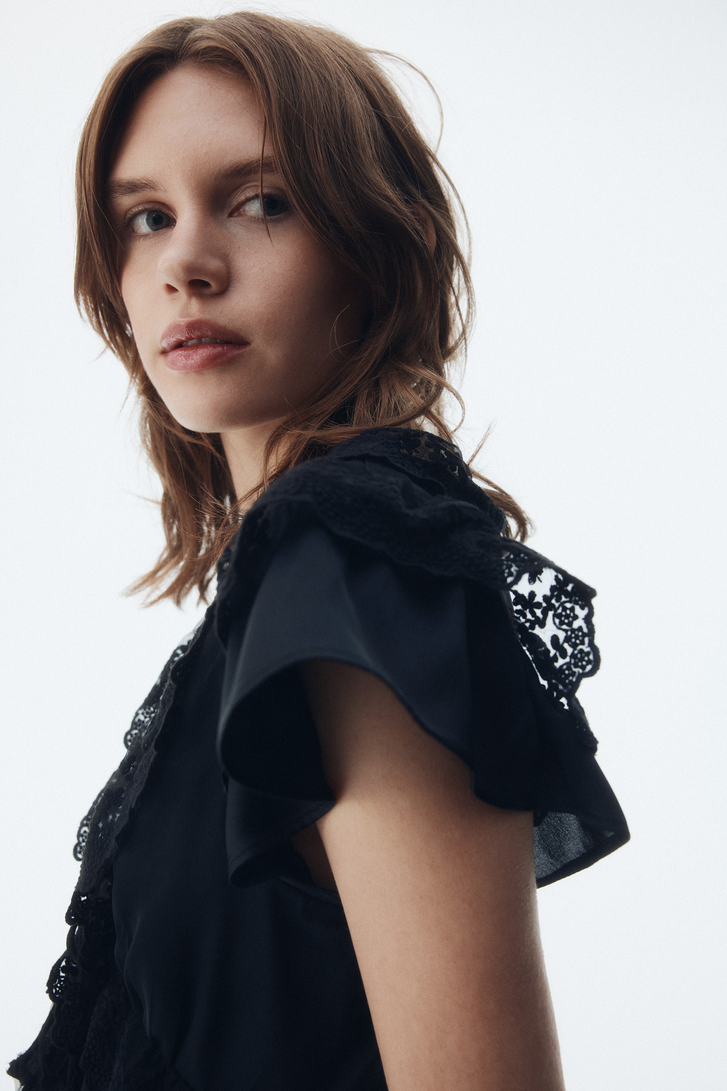 Flounce-trimmed satin blouse