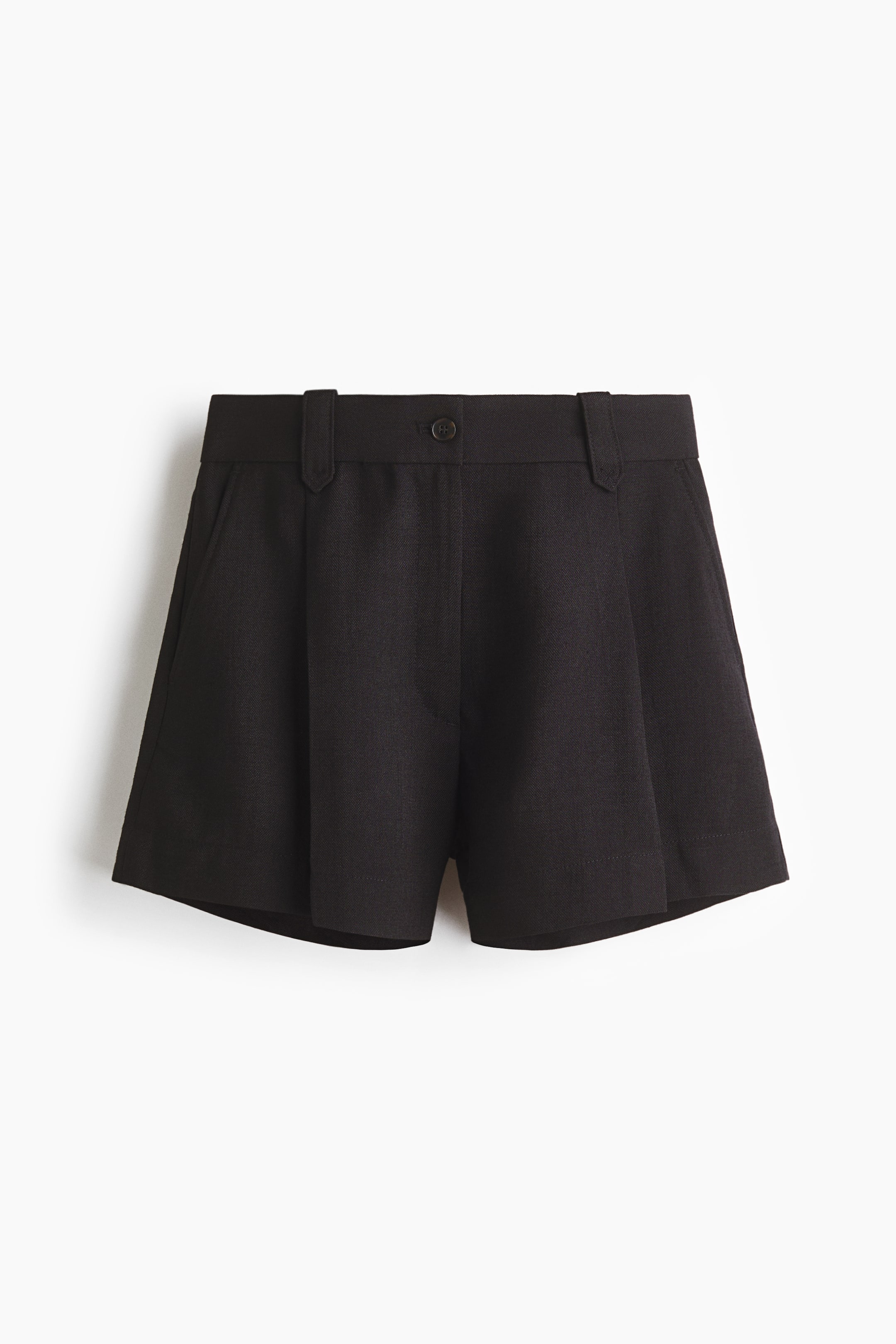 View larger image: These black shorts are displayed from the front, showcasing a high-waisted design with belt loops and a single visible button closure. Front pleats offer a relaxed fit, while slanted side pockets are evident.