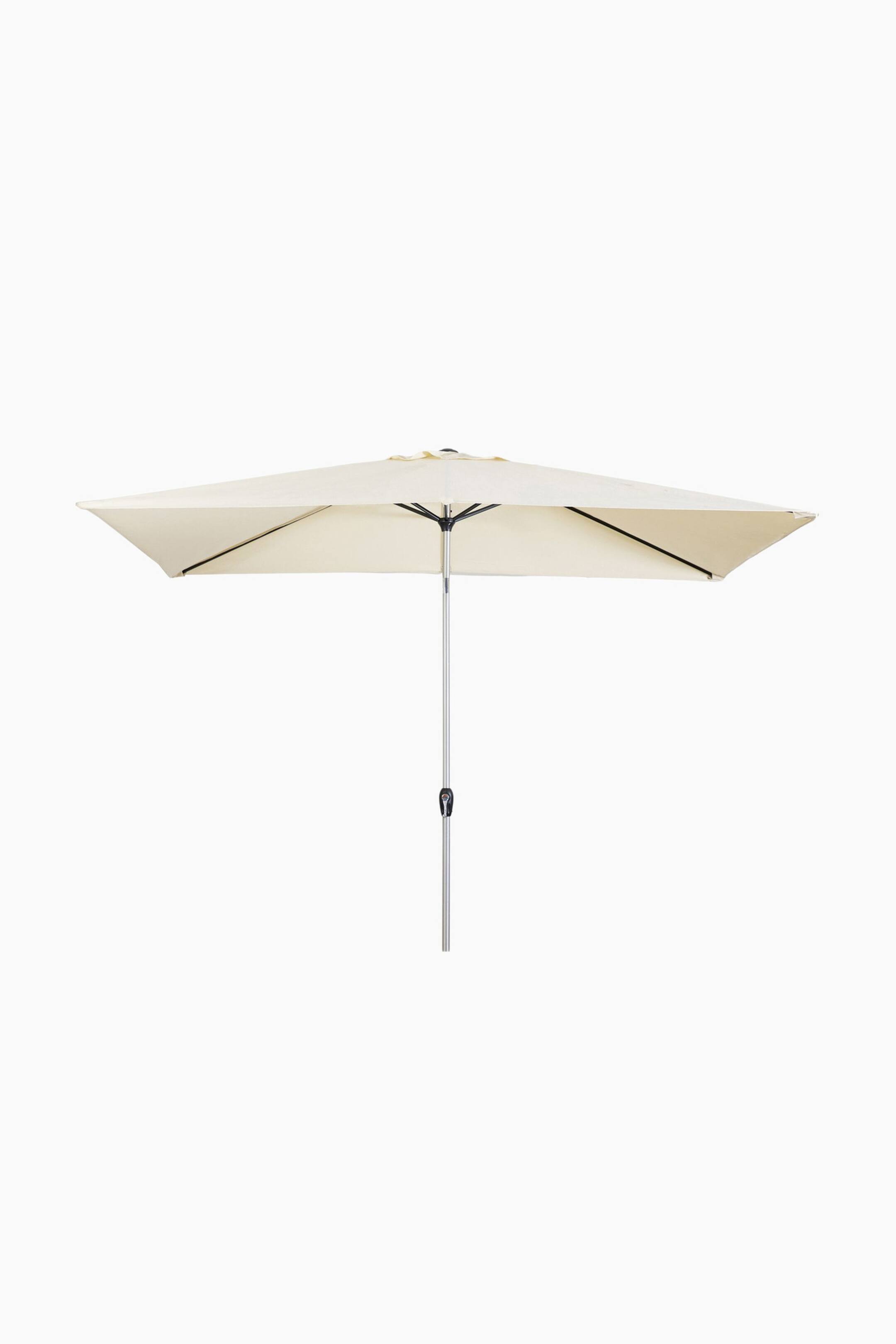 View larger image: A rectangular patio umbrella showcases a fully extended, cream-coloured canopy, supported by a silver pole from which black structural ribs radiate underneath.