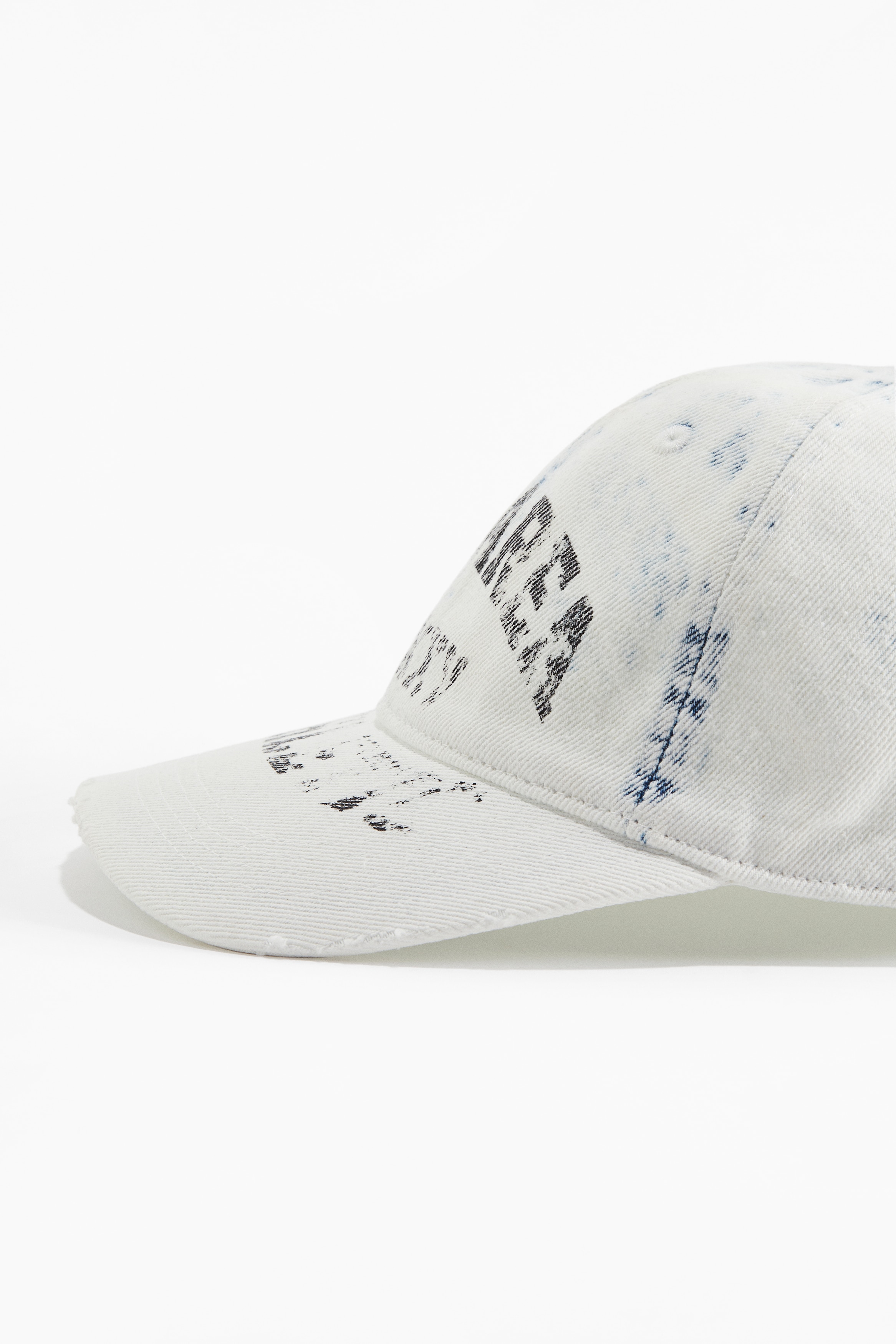 Cap with hard-worn details