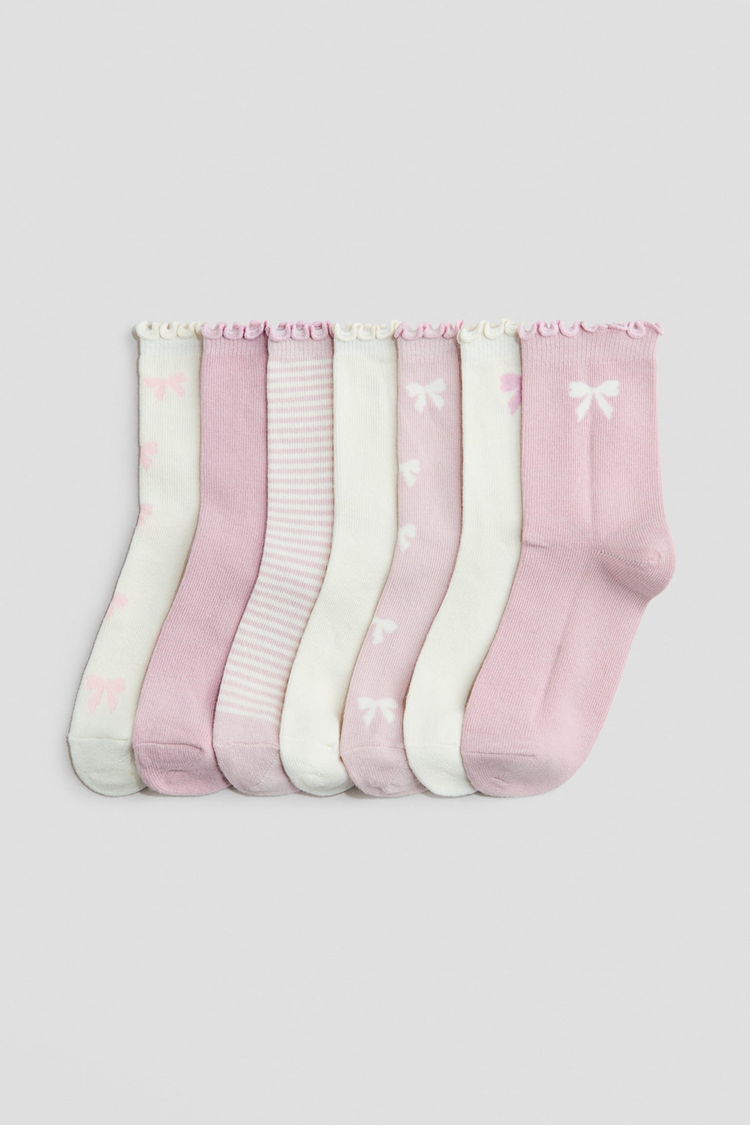 Skarpety 7-pak - Jasnoróżowy/Kokardki/Jasnoróżowy/Jednorożec/Jasnoniebieski/Motyle/Biały/Dni tygodnia/Różowy/Jednorożce/Kremowy/Kwiaty/Biały/Misie/Jasnoróżowy/Truskawki