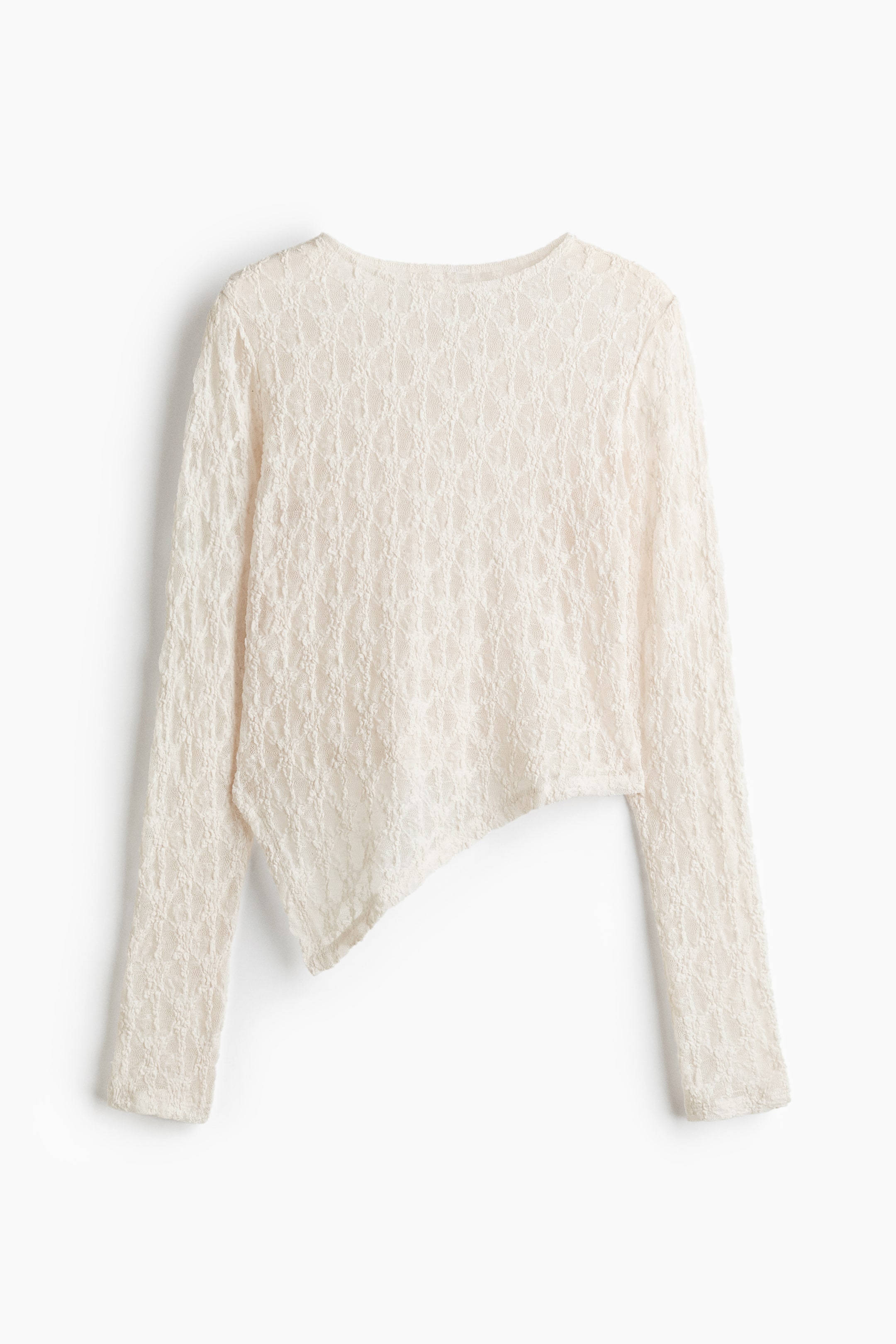 View larger image: An off-white, long-sleeved lace top is shown from the front, featuring textured diamond-patterned fabric and a round neckline. The top highlights a dramatic asymmetrical hemline, slanting diagonally from one side to the other.