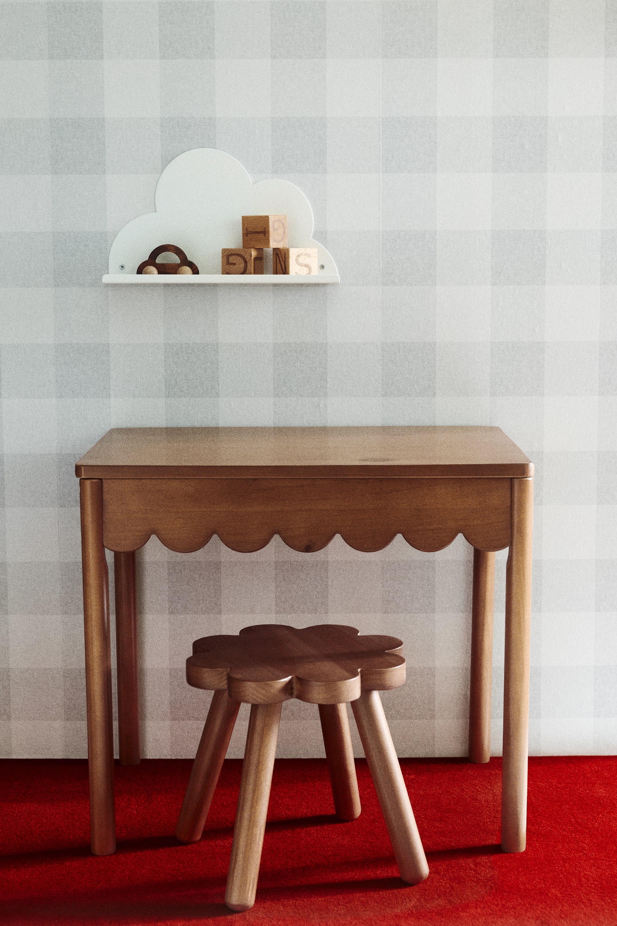 View larger image: A white, cloud-shaped wall shelf is viewed from the front, showcasing a small wooden car and several wooden letter blocks on its surface. It features two visible circular screw holes on its flat, horizontal base.