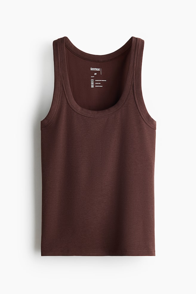 A dark brown fitted vest top is showcased from the front, featuring a ribbed texture, a round neckline, deep armholes, and a straight-cut hem. - 1