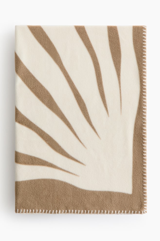 Manta en tejido polar estampado - Beige/Blanco/Beige/Negro/Azul/Blanco/Rojo/Rosa claro - 1