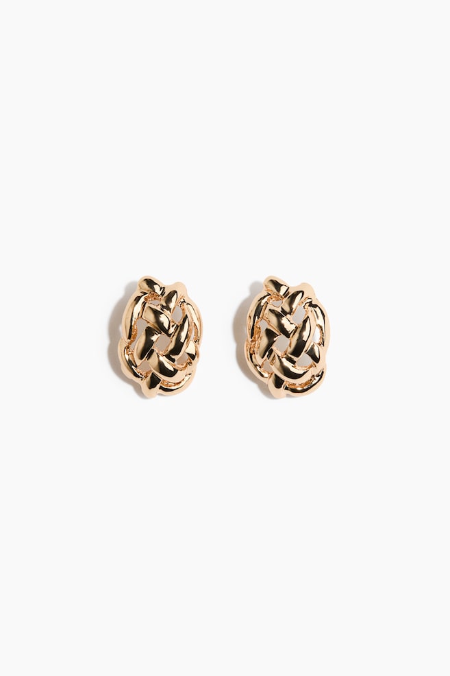 A pair of gold stud earrings featuring a woven knot design. Each earring displays intertwining polished gold bands, creating a rounded, textured appearance. - 1