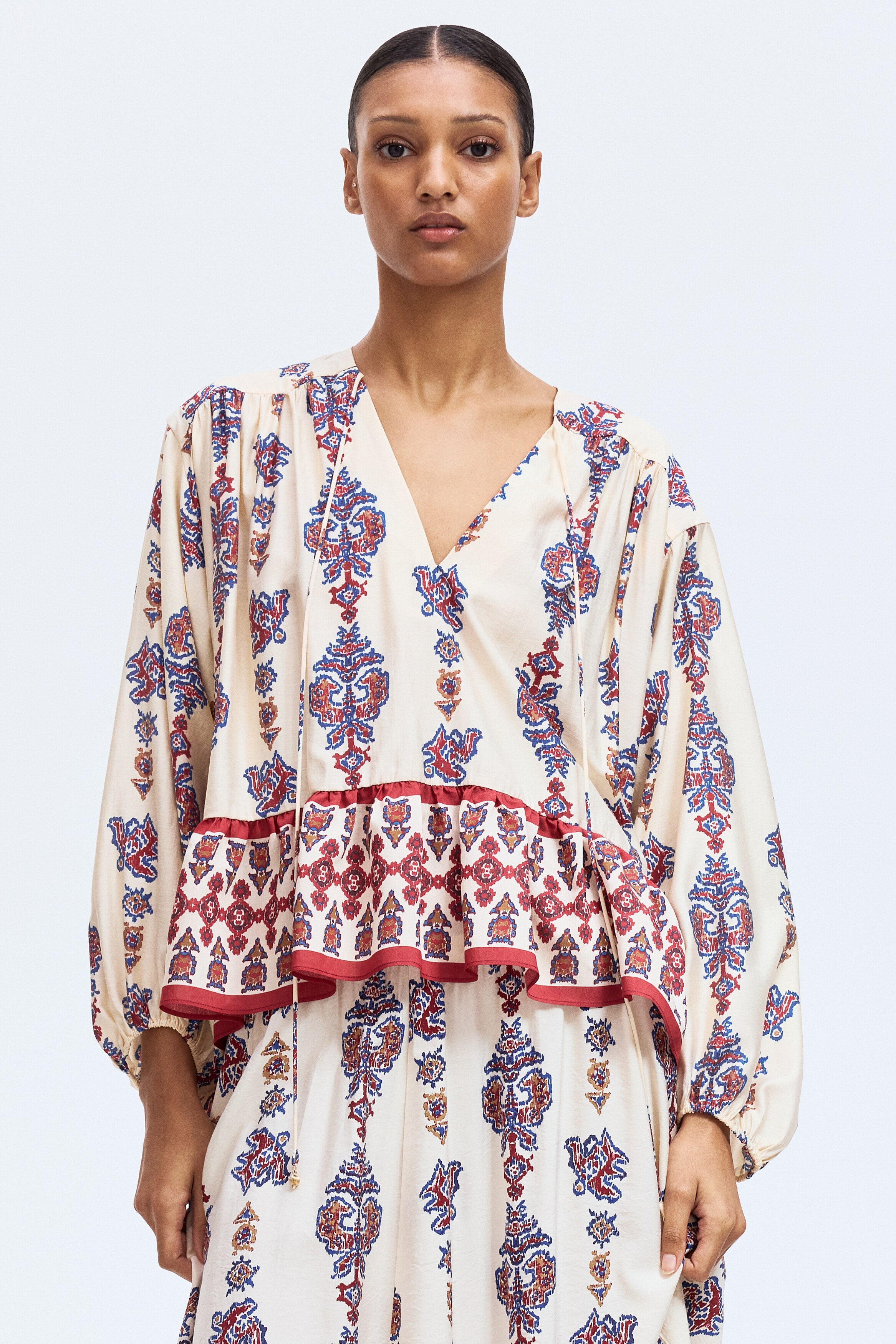 Flounce-trimmed blouse