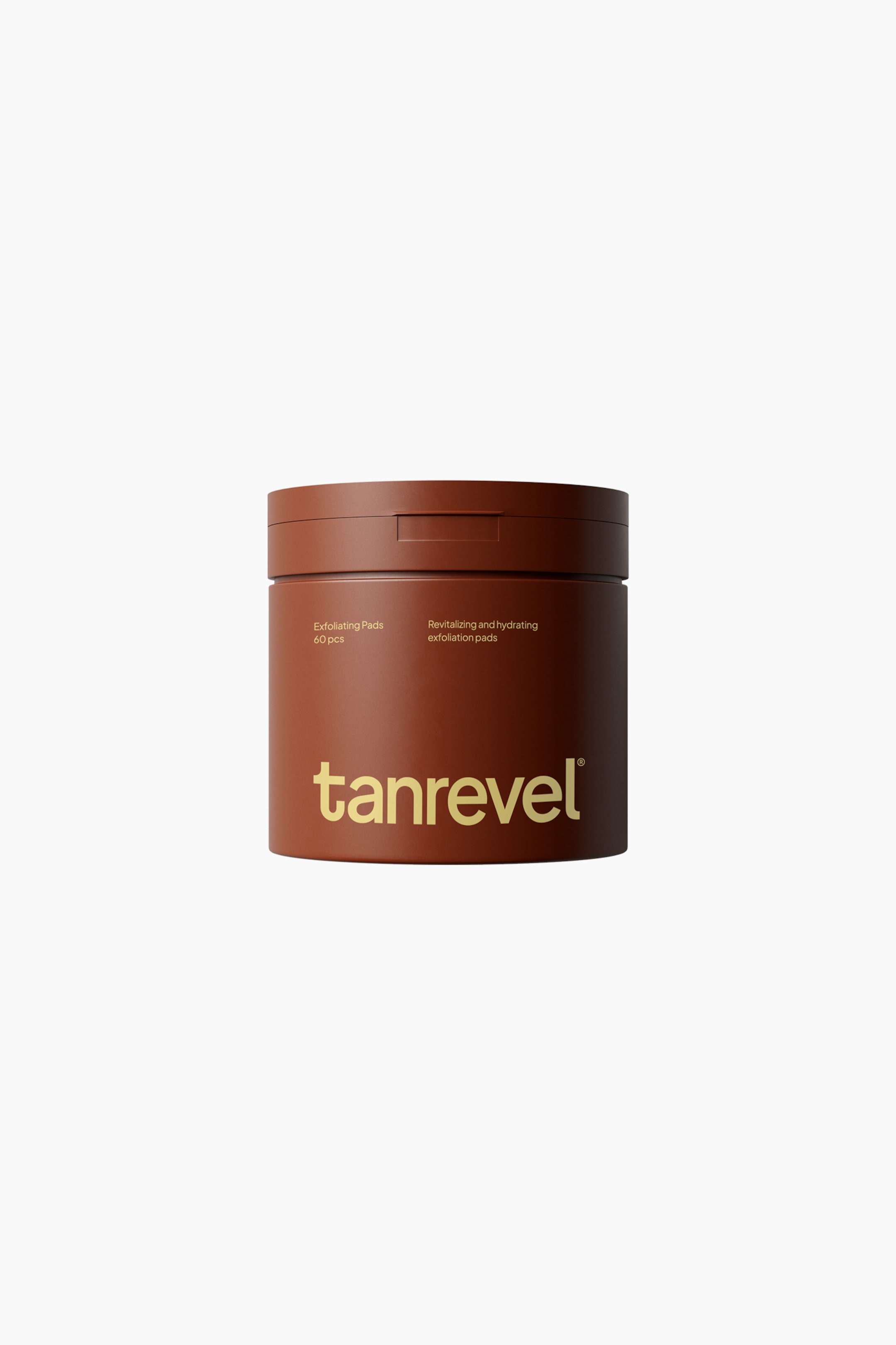 Se større billede: En cylindrisk beholder med eksfolierende pads vender forover og har en mat brun finish samt et matchende låg med en detaljeret frontlås. Krukken er forsynet med gyldent branding-tekst, herunder "tanrevel" nederst og mindre tekst ovenover, der beskriver produktet som "Exfoliating Pads" og angiver "60 pcs".