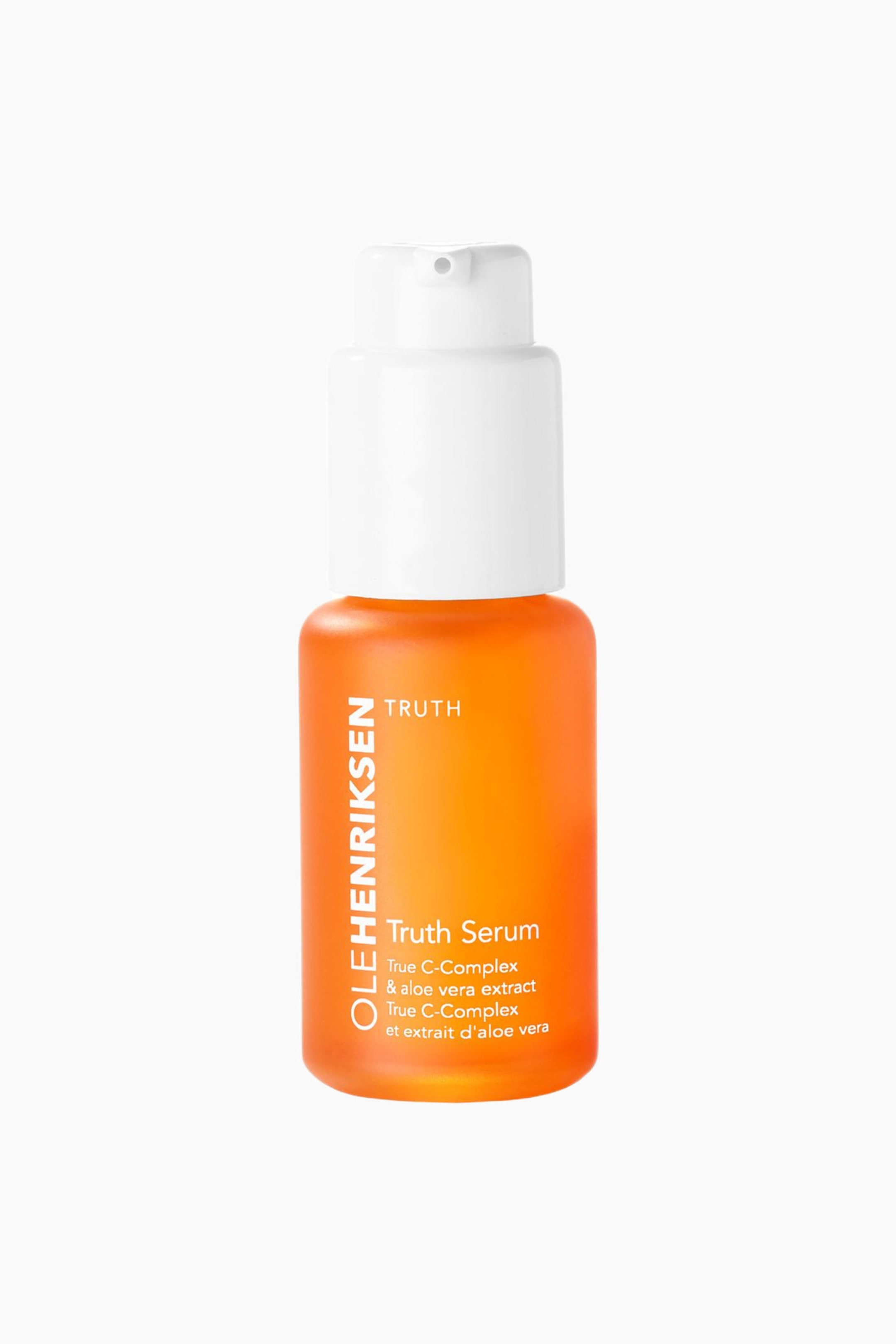 Se større billede: En Olehenriksen Truth Serum-flaske står vendt fremad og har en orange, gennemsigtig krop og en hvid pumpedispenser. Etiketten viser 'Truth Serum' og 'True C-Complex & aloe vera extract' på forsiden.