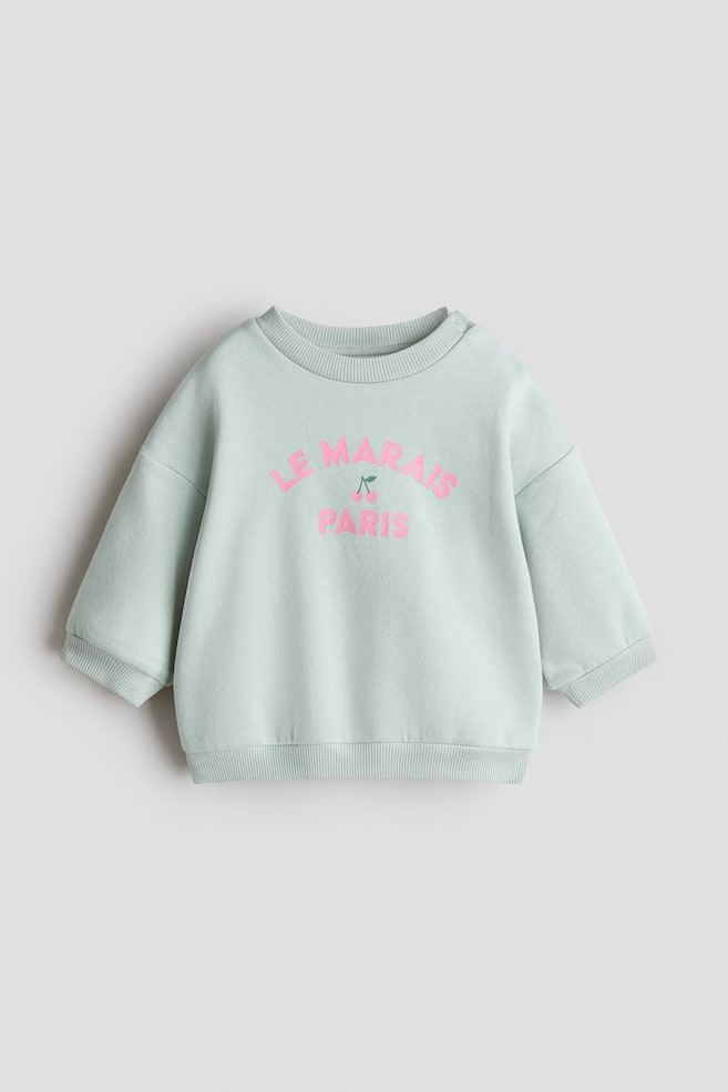 Sweatshirt mit Print - Mintgrün/Le Marais/Hellrosa/Geblümt/Helles Mattblau/Geblümt/Cremefarben/Kirschen/Hellrosa/Geblümt - 1