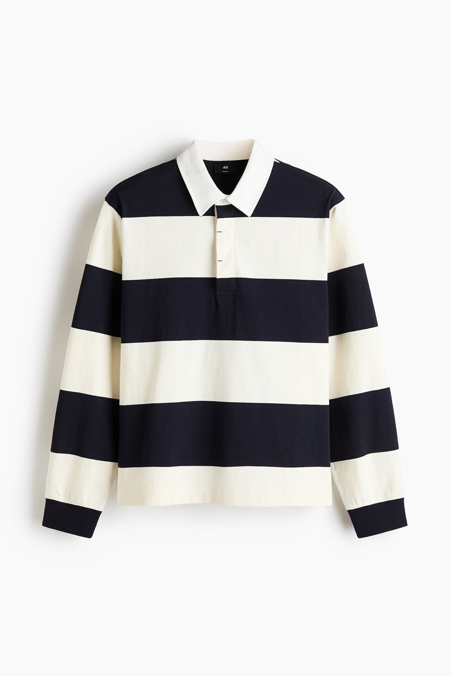 The rugby shirt is showcased from the front, highlighting striking horizontal stripes in navy blue and off-white. It boasts a white turn-down twill collar, a concealed three-button placket, dropped shoulders, long sleeves, and rib-trimmed cuffs. - 1