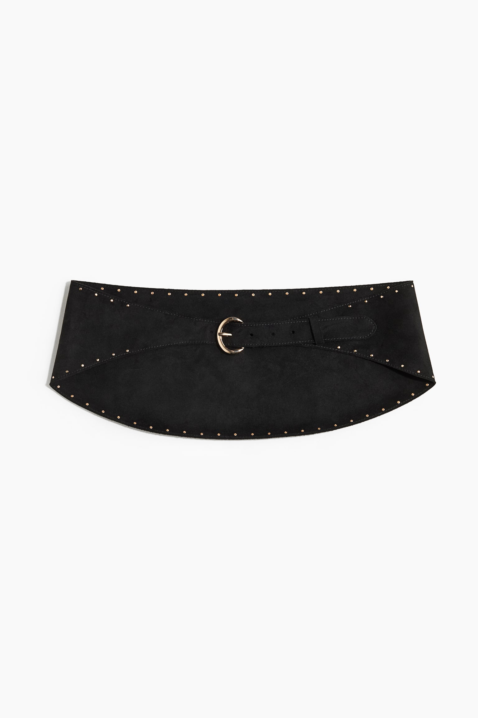 A wide, curved black suede waist belt is laid flat, facing front, showcasing tiny gold-toned studs along its outer edges and diagonal seams. The belt fastens at the center with a smaller integrated strap and a polished, gold-toned crescent-shaped buckle.