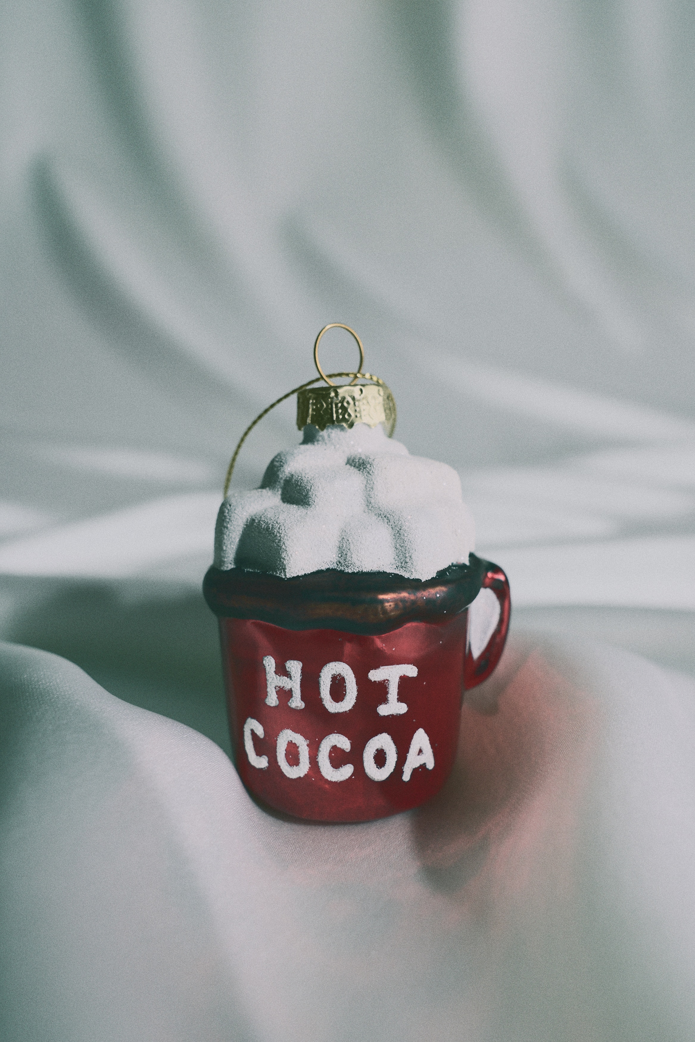 Glass Christmas Ornament - Red/Hot Cocoa/Dark beige/croissant/Dark beige/house/Silver-colored/moka pot/Silver-colored/coffee cup/Silver-colored/caviar tin/Gold-colored/pompom hat/White/skate/Gold-colored/cable car/White/mitten/Gold-colored/skis/Gold-colored/boots