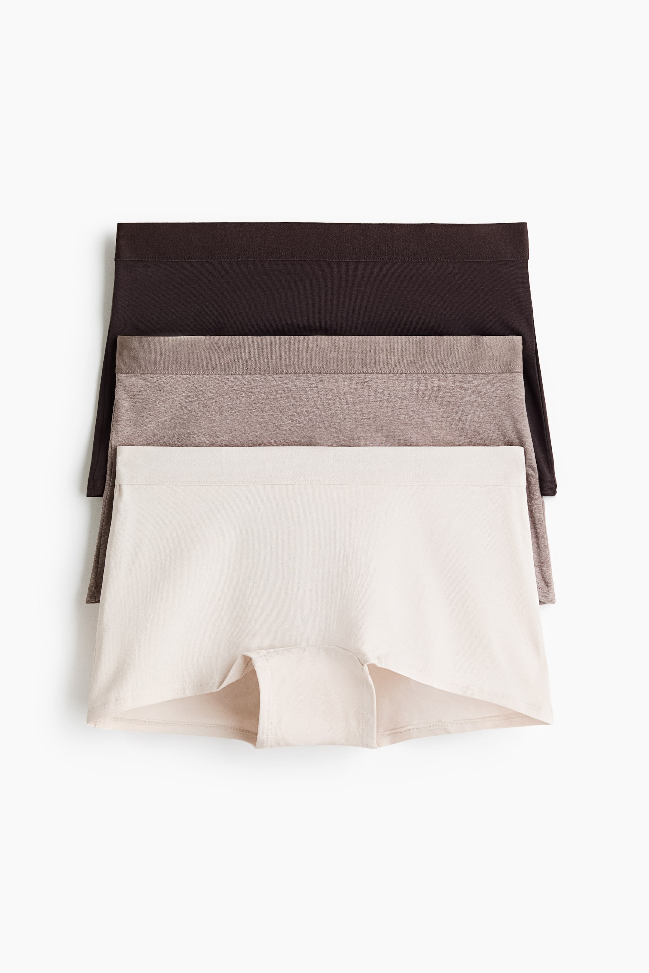 View larger image: Three pairs of boxer briefs are stacked, displaying their front view. The dark brown, heathered light brown, and off-white pairs feature a mid-rise waist and a lined gusset.
