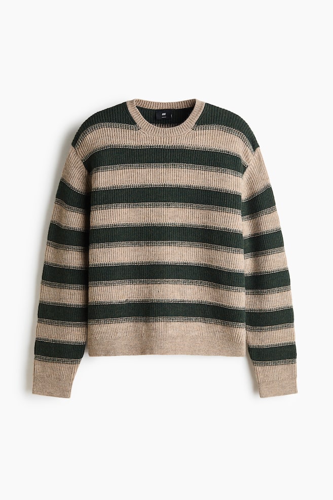 A rib-knit jumper featuring horizontal dark green and beige stripes is shown from a front-facing view. The jumper showcases a round, rib-trimmed neckline, dropped shoulders, and long sleeves ending in ribbed cuffs and a ribbed hem. - 1
