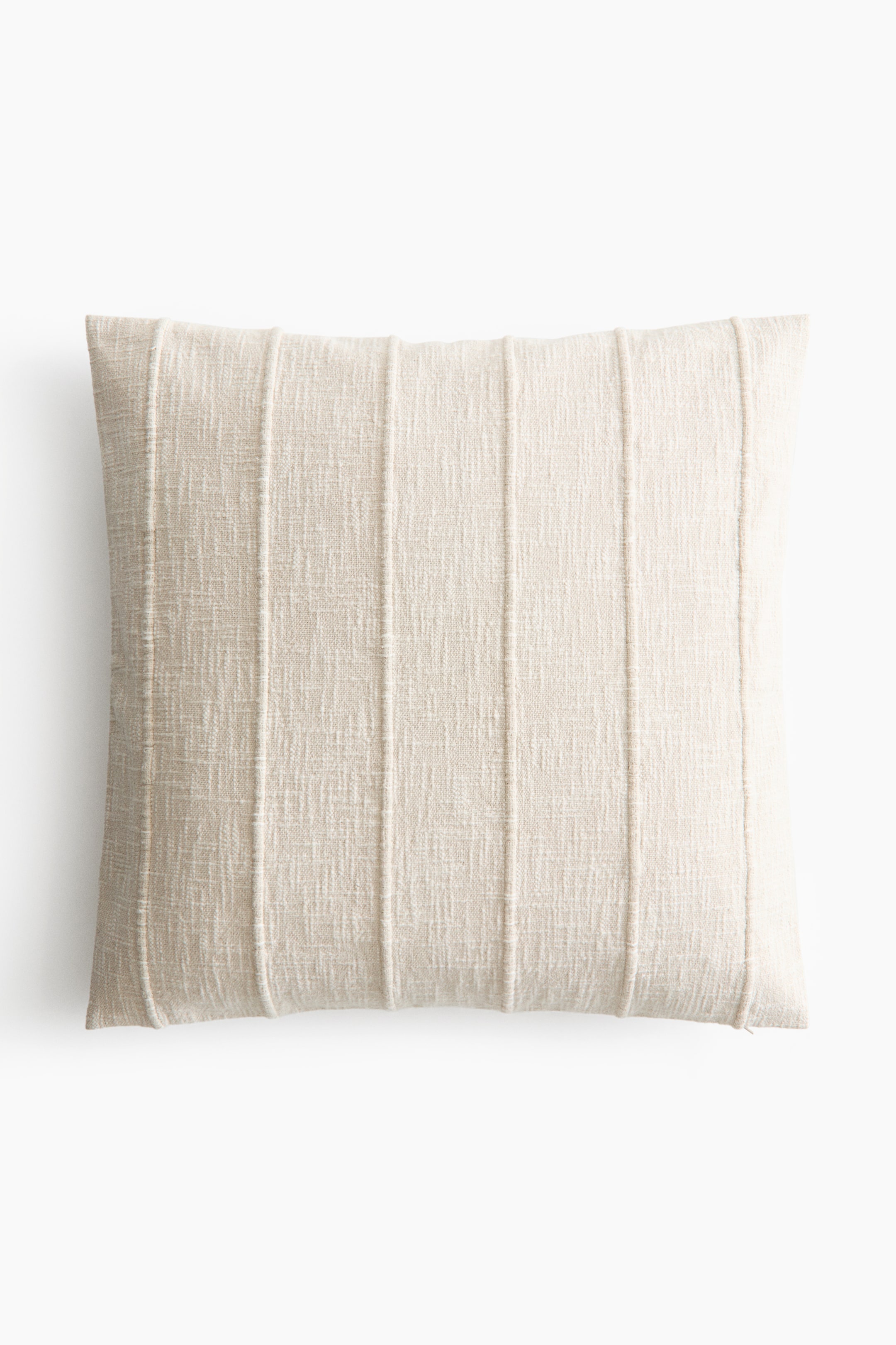 View larger image: A rectangular light beige pillow showcases a textured fabric with evenly spaced vertical stitched lines.