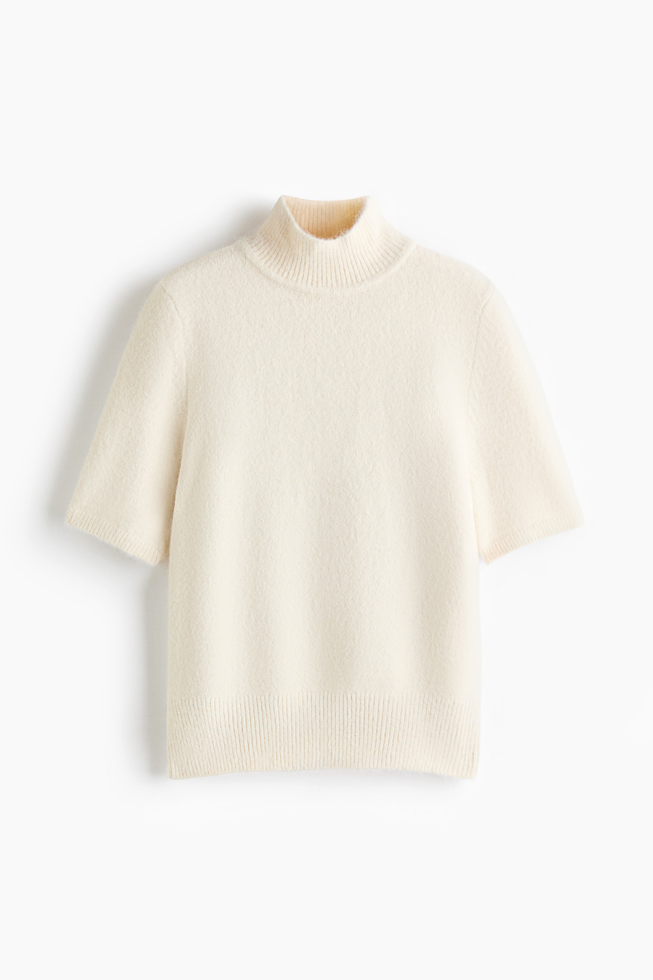 View larger image: A cream-coloured, short-sleeved knit top is shown from the front, featuring a ribbed mock neck and a soft, slightly fuzzy texture. The garment has short sleeves with ribbed cuffs and a matching wide ribbed hem.