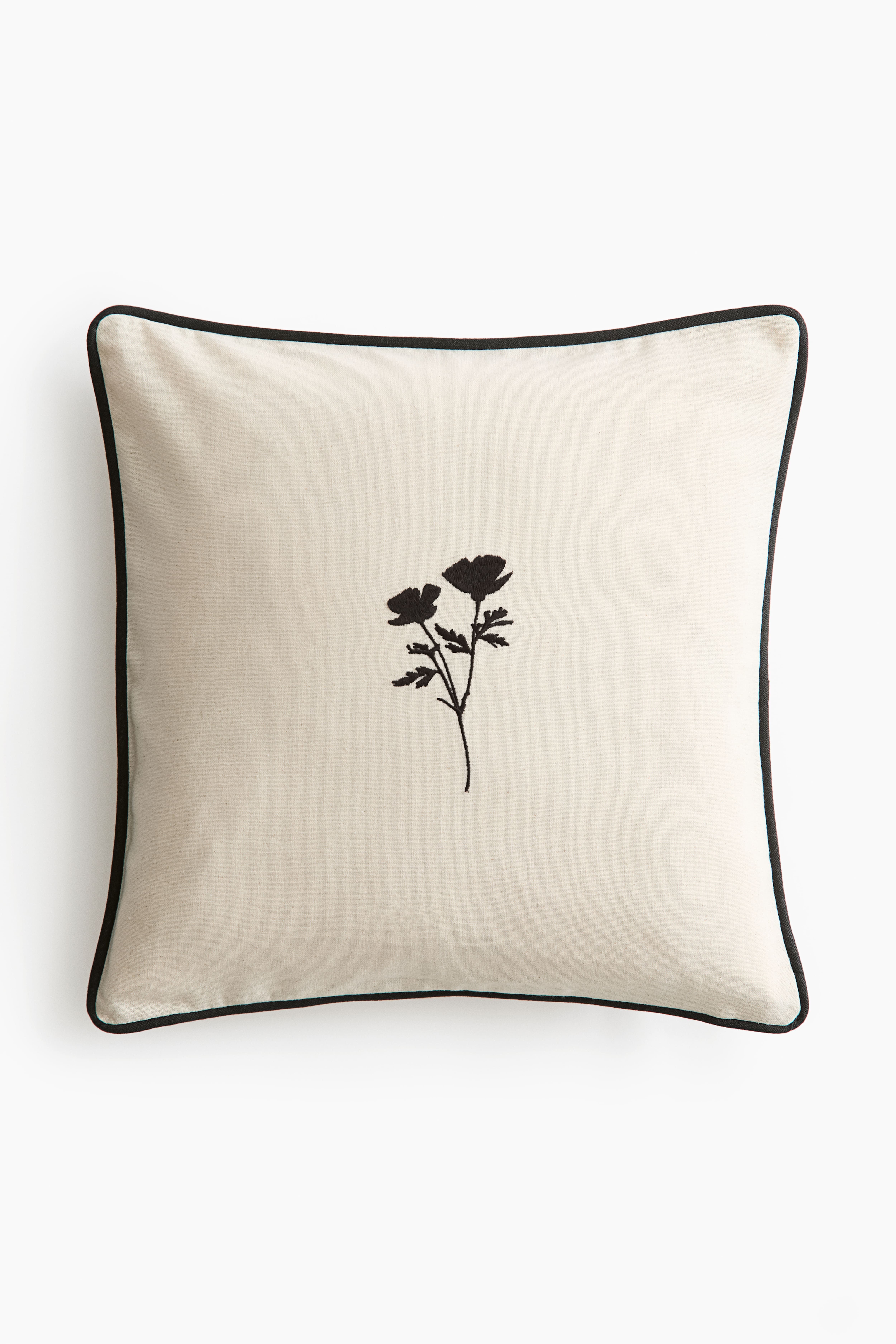 Housse de coussin en coton avec motif brodé