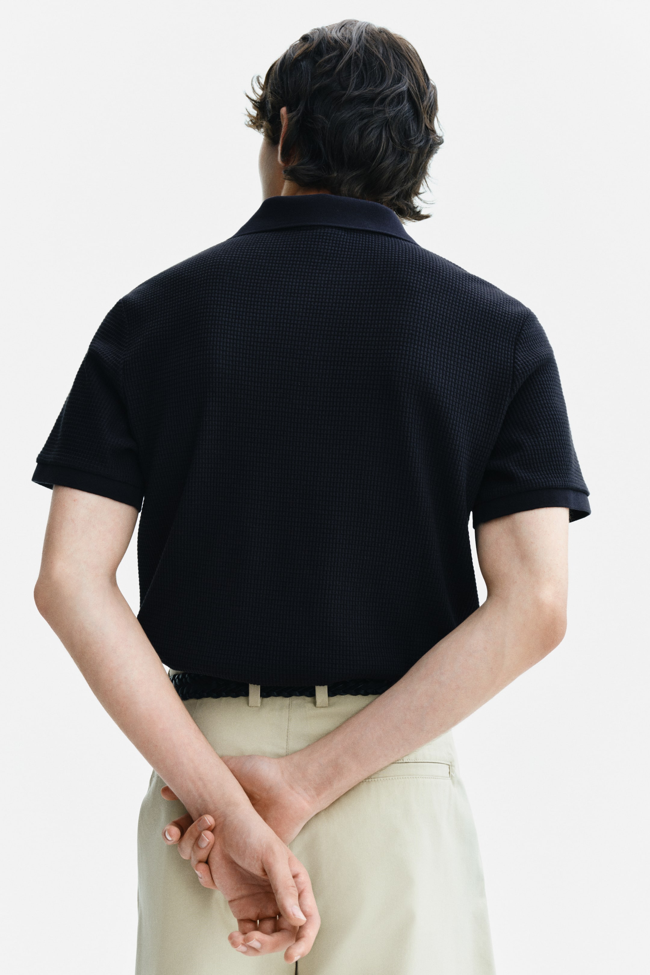 Polo près du corps en tricot gaufré