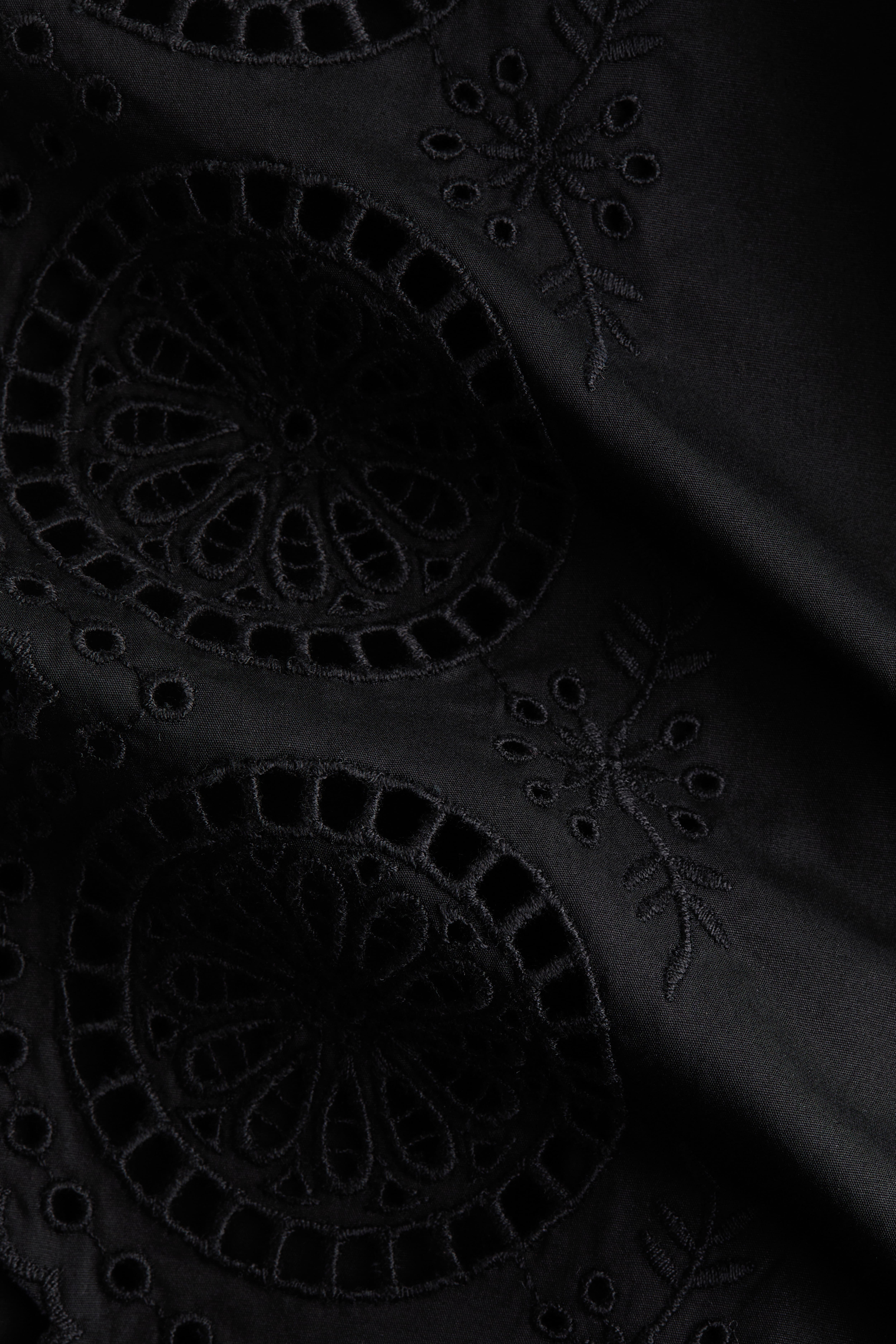 Pantalon avec détails à nouer et broderie anglaise