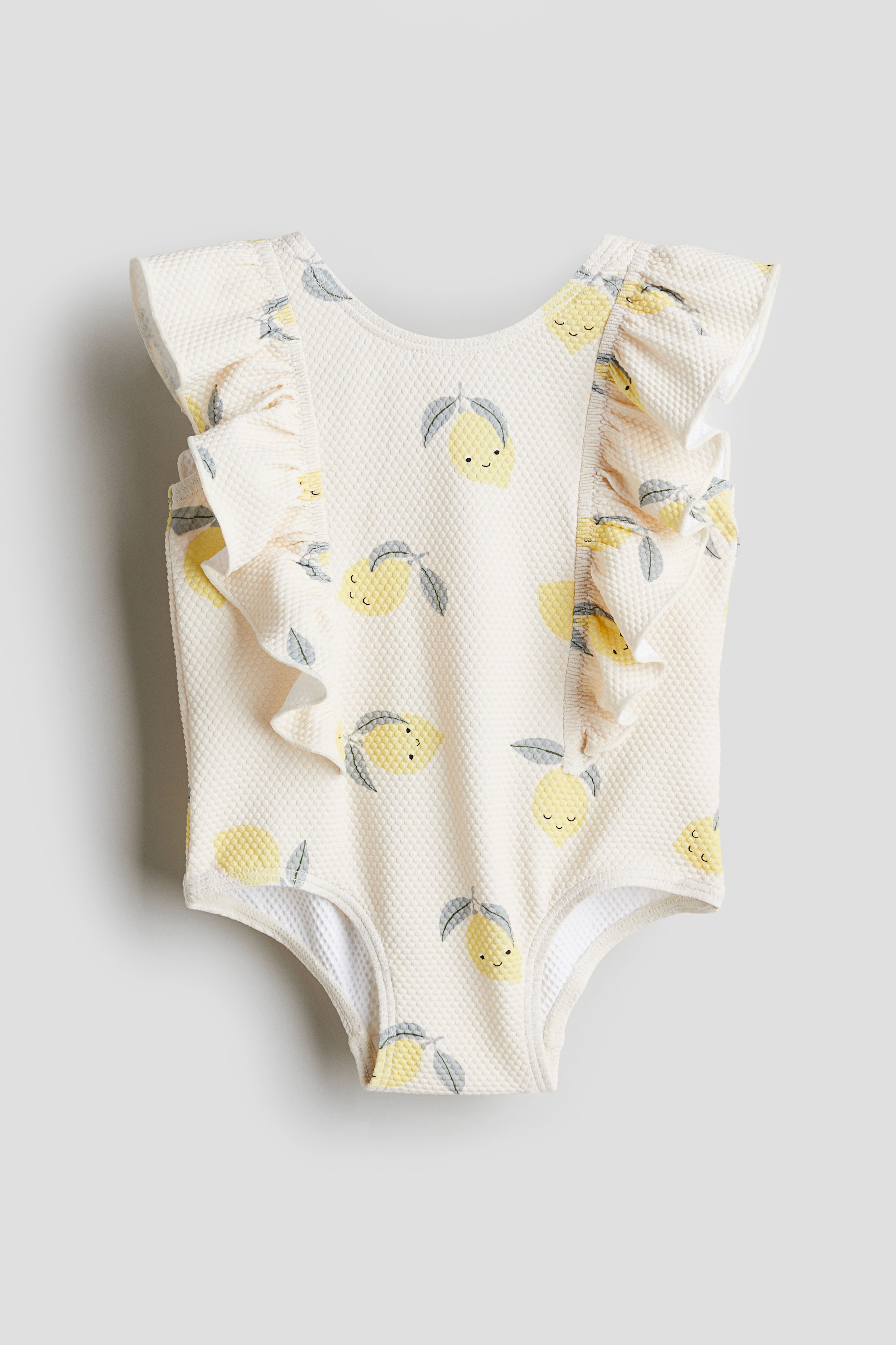 Flounce trimmed swimsuit Cream Lemons Kids H M IE