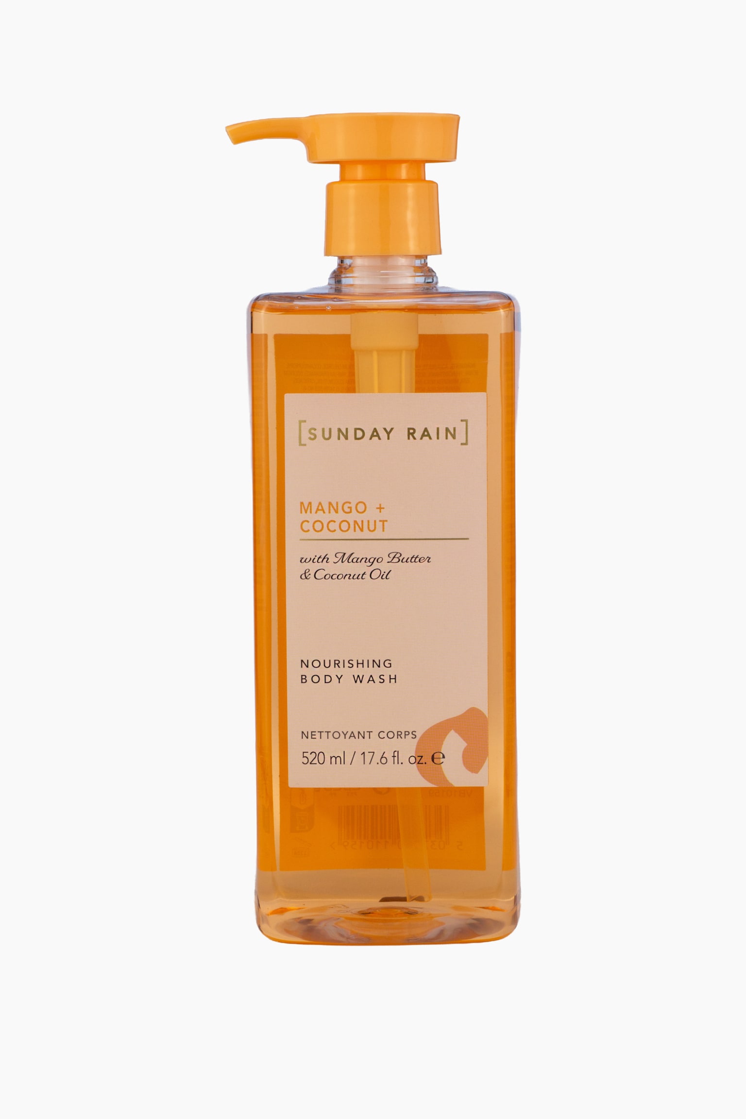 En rektangulær, gjennomsiktig plastflaske med Sunday Rain Nourishing Body Wash står oppreist og vendt forover, og fremhever den gjennomskinnelige oransje væsken. Flasken har en matchende oransje pumpedispenser på toppen og en beige frontetikett som viser produktnavnet «Mango + Coconut» i oransje og svart skrift. - 1