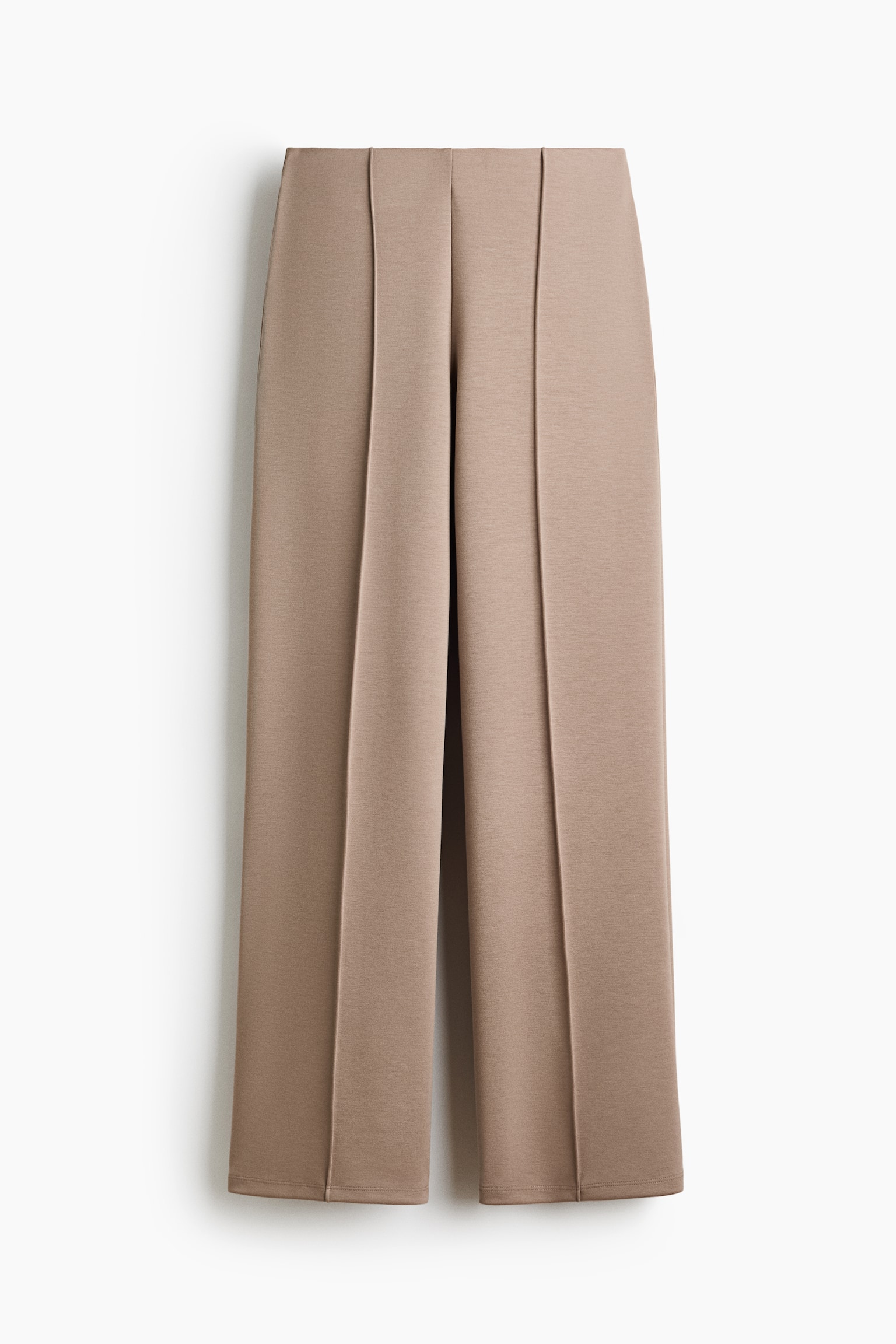 The taupe wide-leg trousers are shown from a front perspective, featuring a flat waistband and prominent stitched creases running down the front of each leg. They conclude with a neat hem. - 1