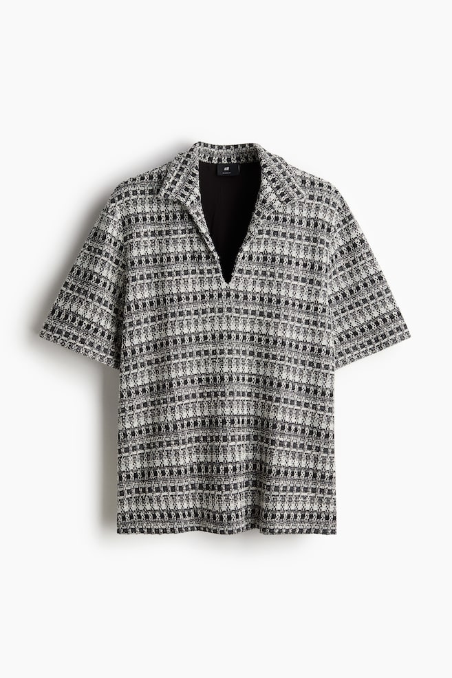 Poloshirt aus Tweed in Loose Fit - Schwarz/Gemustert - 1