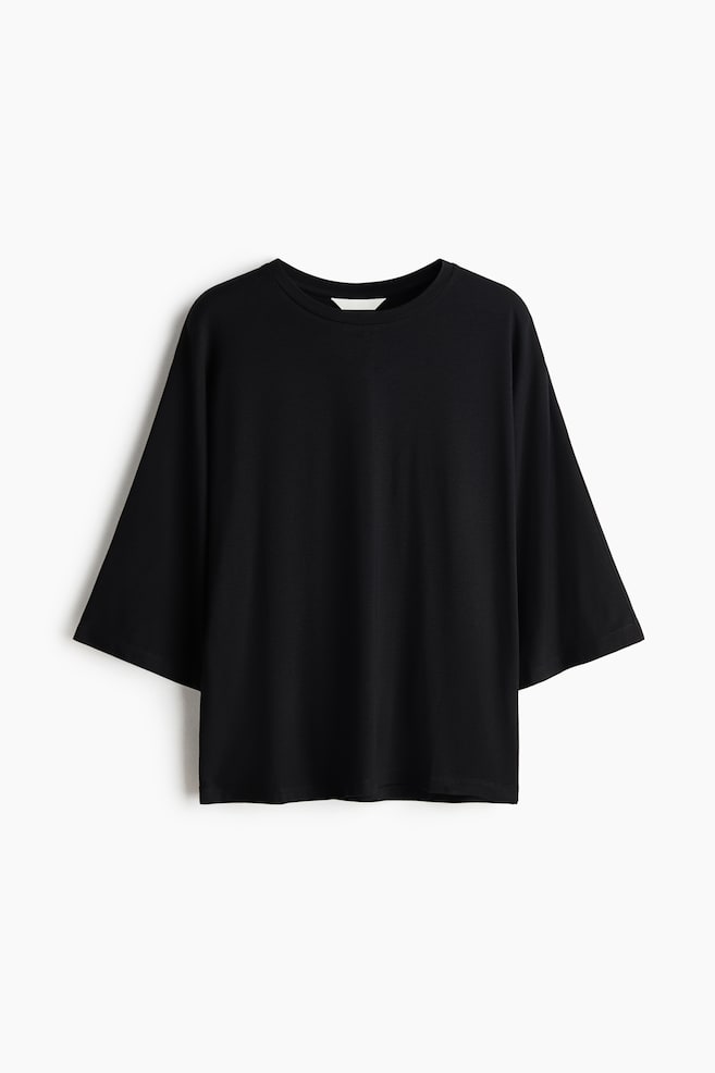 Geripptes Shirt mit Fledermausärmeln - Schwarz/Dunkelbraun/Cremefarben - 1