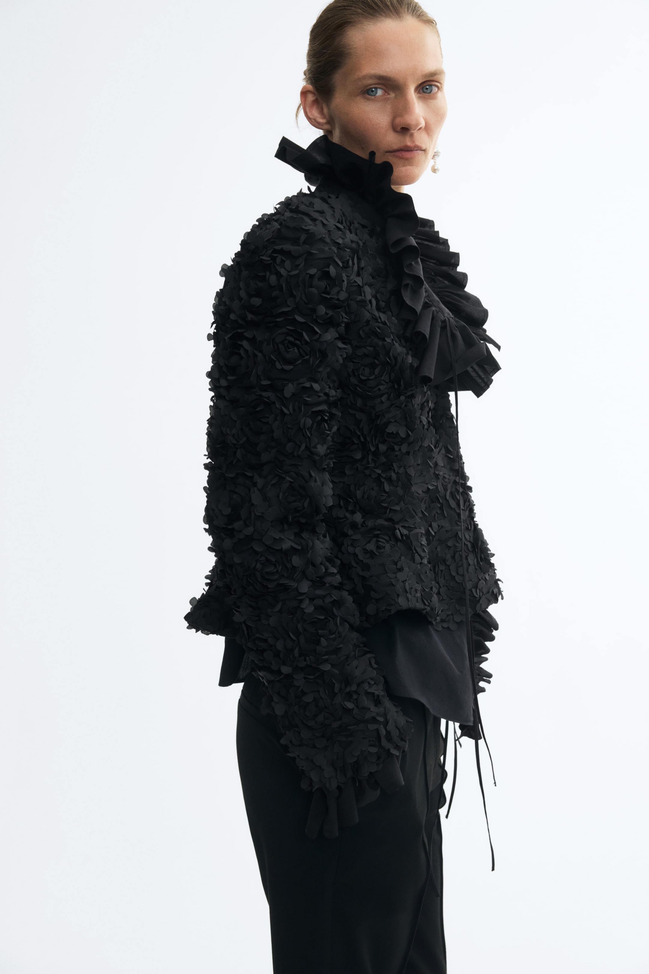 Blazer péplum avec appliqués