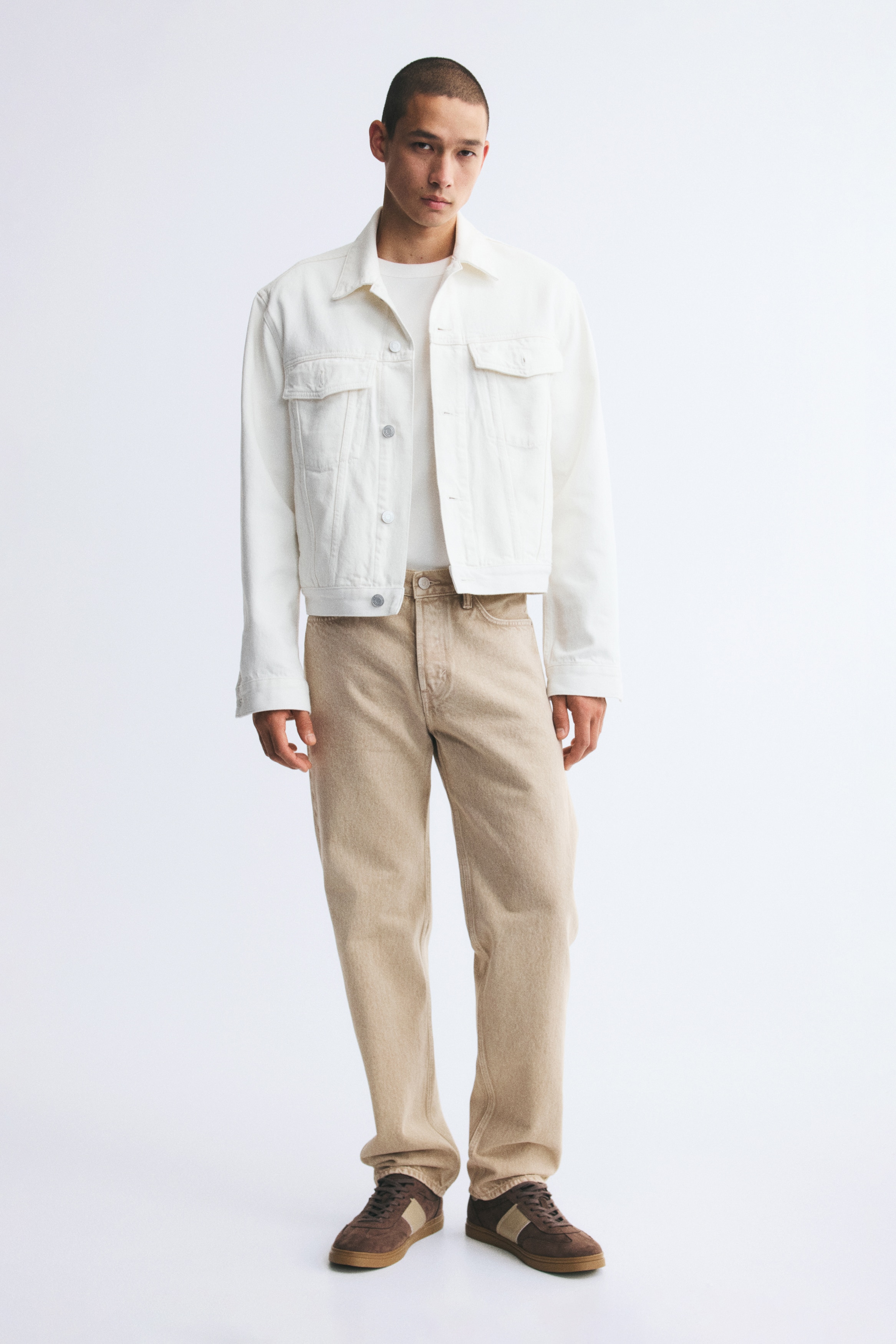 Light beige 5-pocket denim jeans are shown in a front-facing view, featuring a regular waist with belt loops, a button fastening, and straight legs with a relaxed fit.