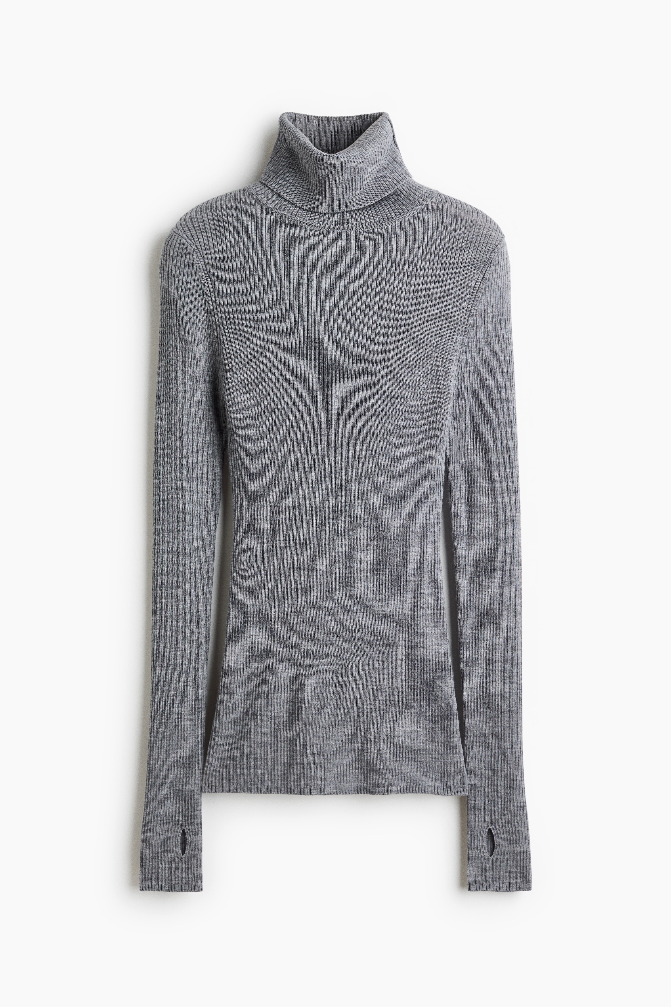 A grey rib-knit roll-neck top is being worn by the model, featuring a fitted silhouette and long sleeves with thumbholes. The model is holding one sleeve to showcase the extended cuff design, with the top styled with black belted jeans.