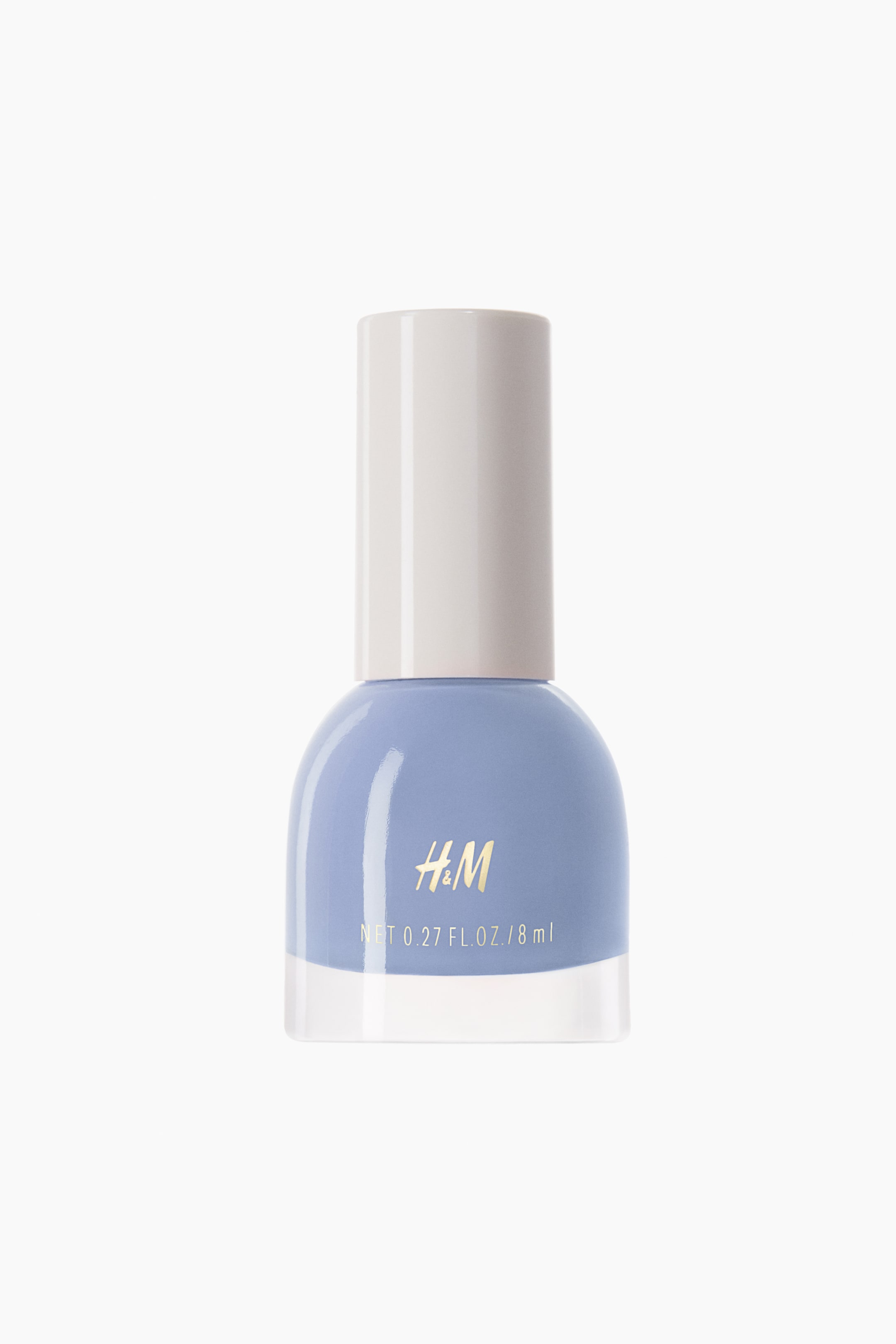 Ver imagen más grande: Un frasco de esmalte de uñas color lavanda está de pie, mirando hacia adelante, con una base de vidrio transparente, una parte superior redondeada que contiene el esmalte lavanda y un tapón cilíndrico de color beige claro. La marca "H&M" en dorado y "NET 0.27 FL. OZ./8 ml" se muestran en la parte frontal de la sección redondeada.