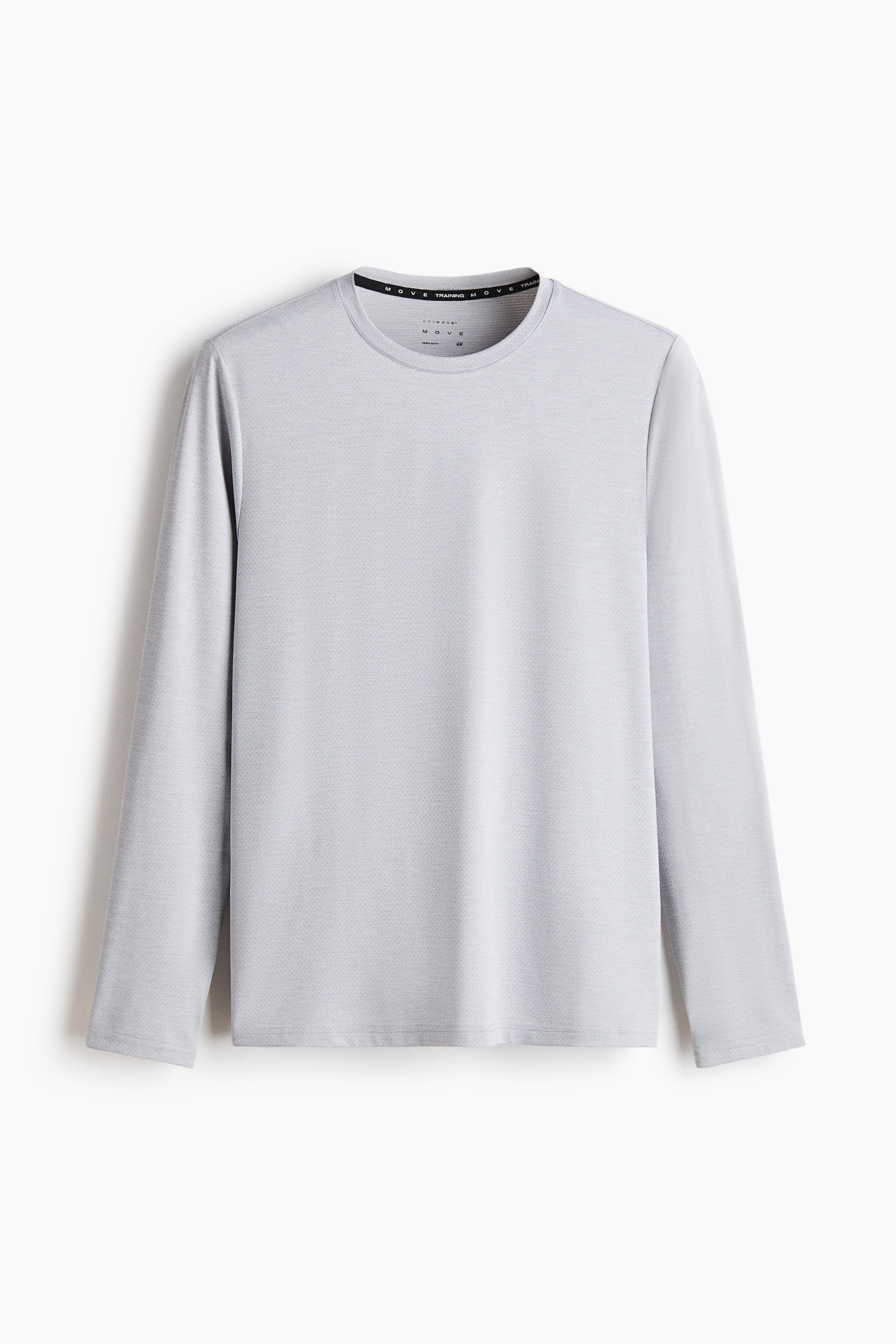 View larger image: A long-sleeved sports top with DryMove? is shown from the front, displaying a light gray color and a subtle, all-over textured pattern. It features a crew neck, long sleeves, and a black band inside the collar bearing the text 'MOVE TRAINING MOVE'.