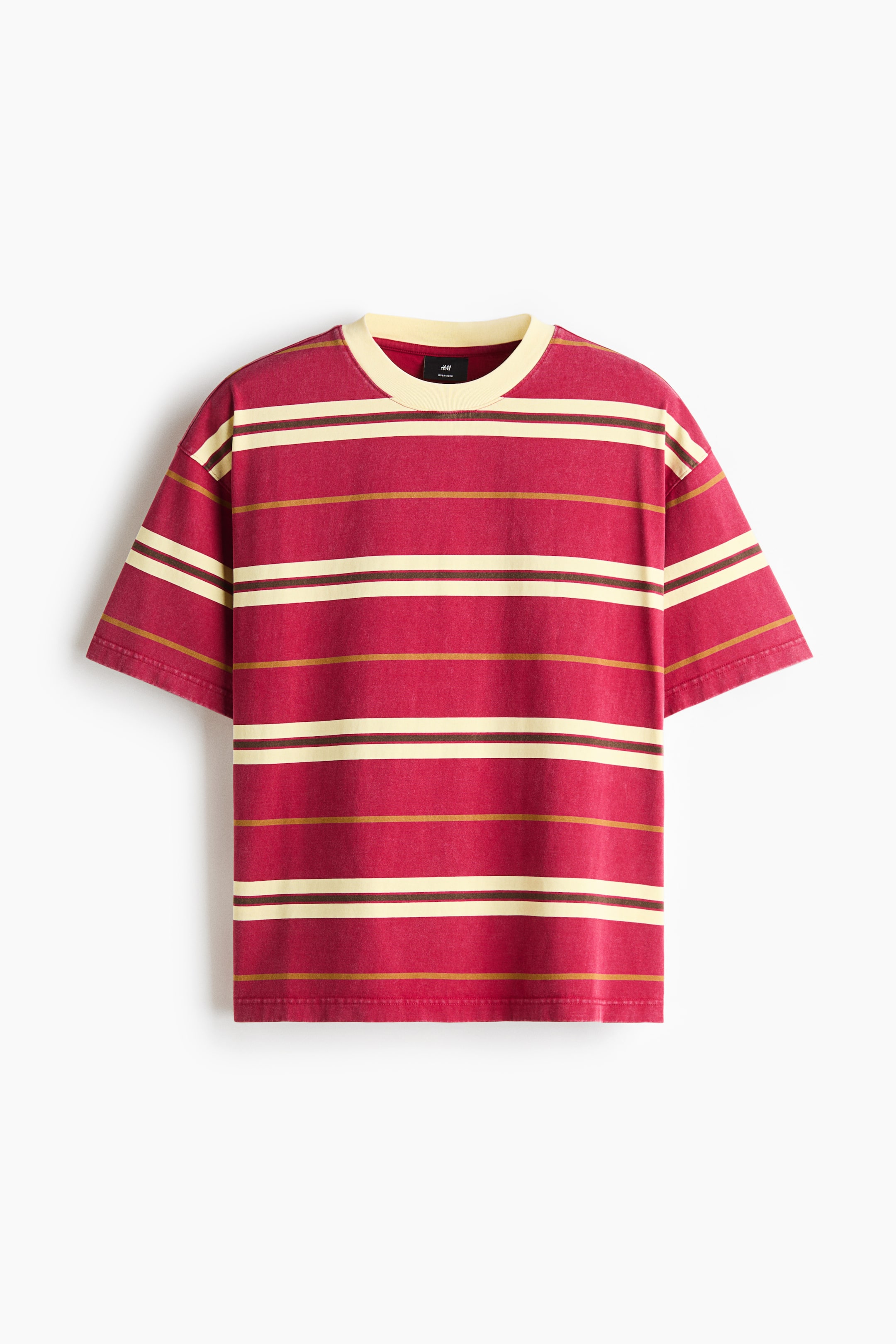 View larger image: A loose-fit, short-sleeved T-shirt in washed red is shown from the front, featuring horizontal stripes in cream, dark brown, and mustard yellow. The garment has a contrasting cream ribbed crew neck and dropped shoulders.
