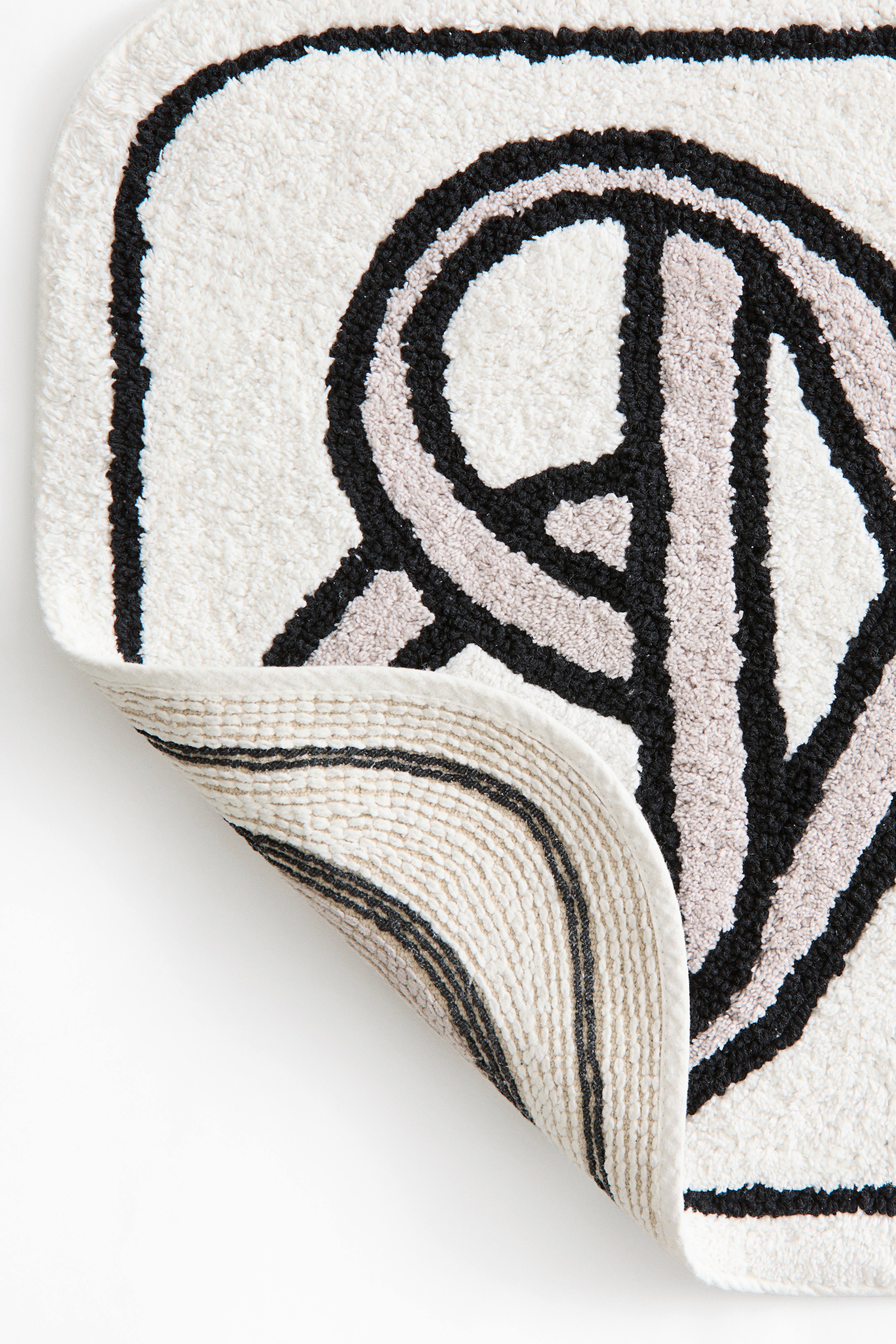 Tapis de bain avec motif
