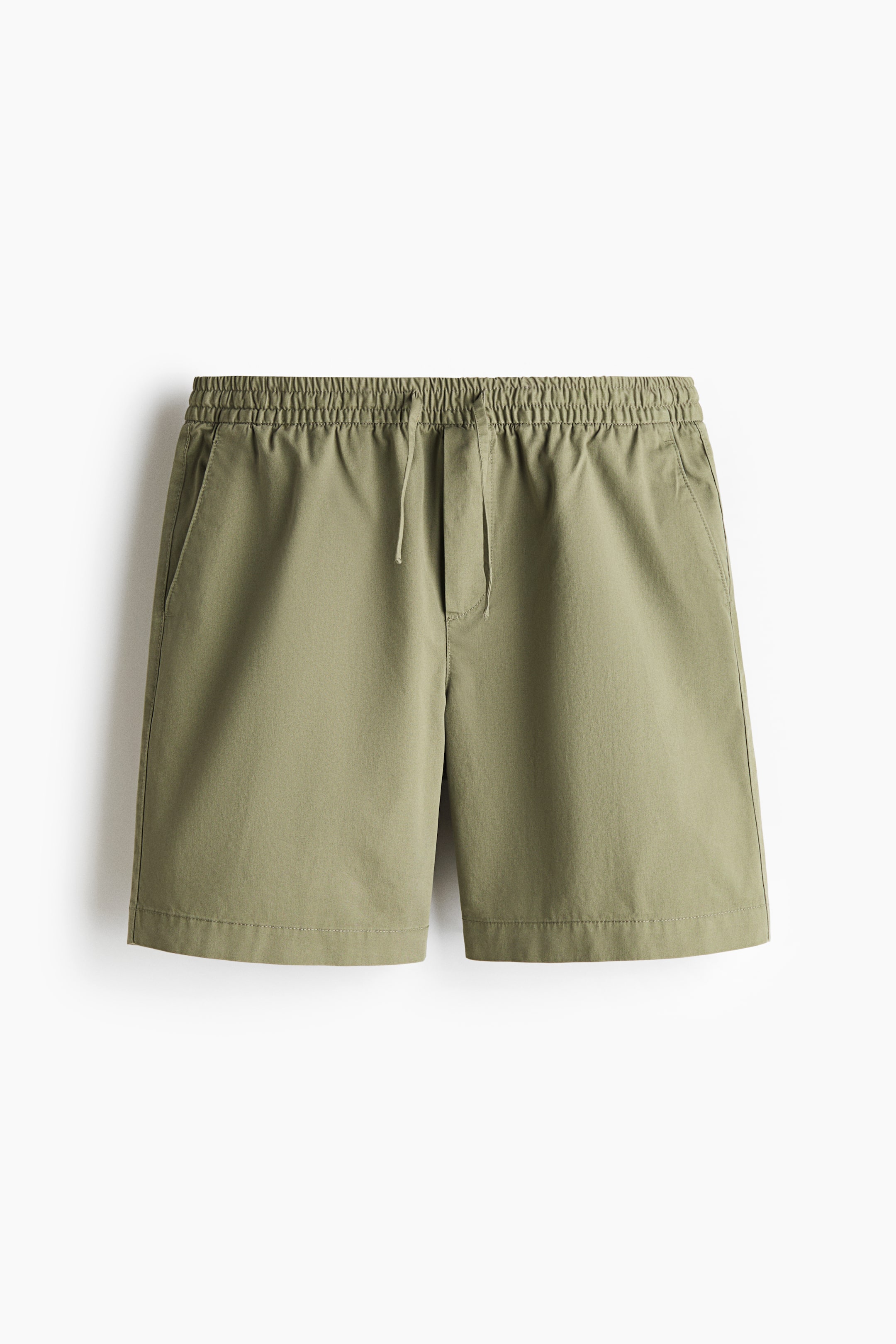 View larger image: Olive green shorts are shown from the front, featuring an elastic waistband with a visible drawstring tie. Two side slash pockets are visible on the front, and the legs end with a straight hem.