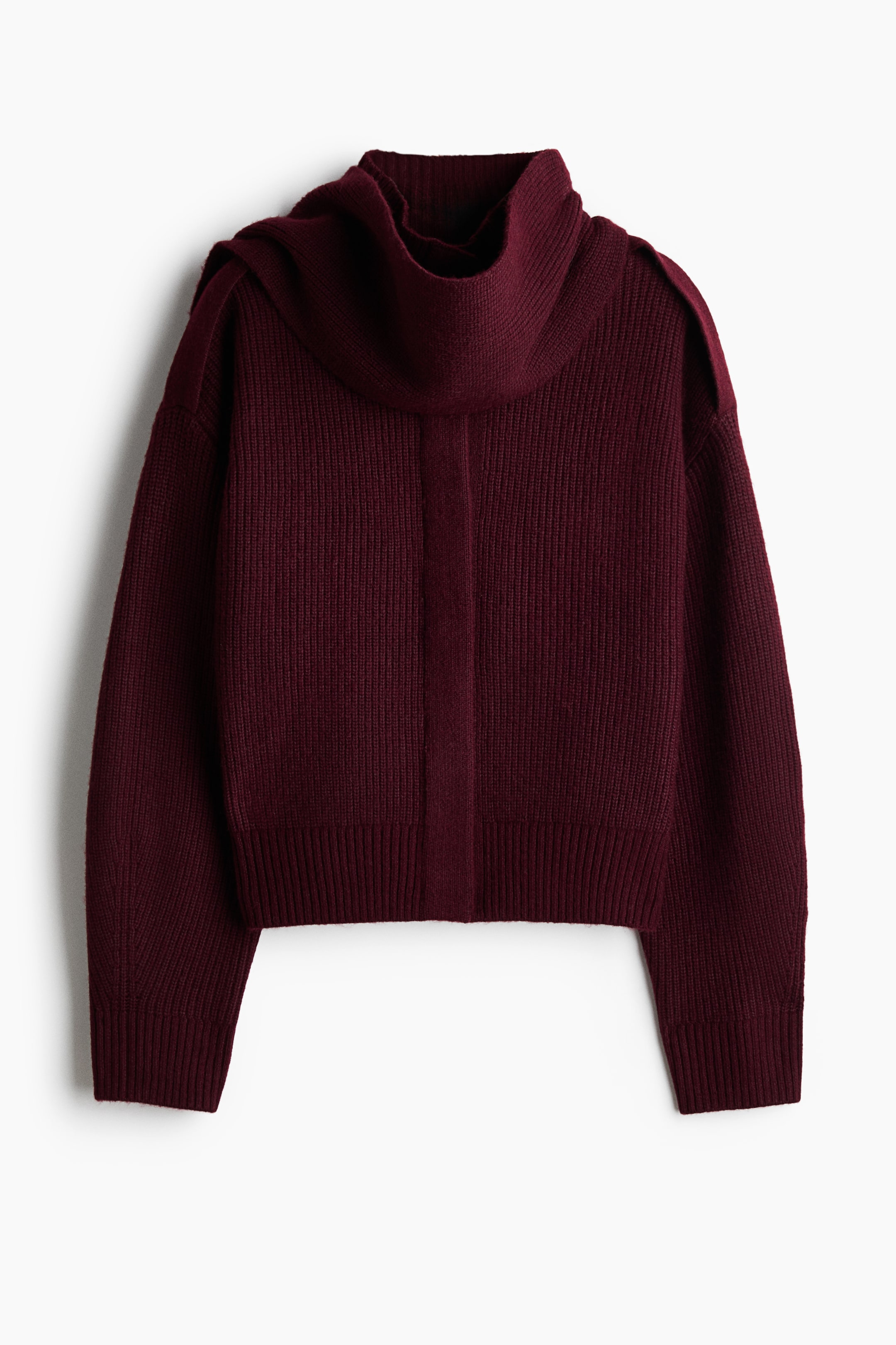 View larger image: A burgundy ribbed-knit sweater is shown from the front, featuring a draped cowl neck collar that extends over the shoulders. It has long sleeves with ribbed cuffs, a ribbed hem, and a contrasting vertical band running down the centre front.