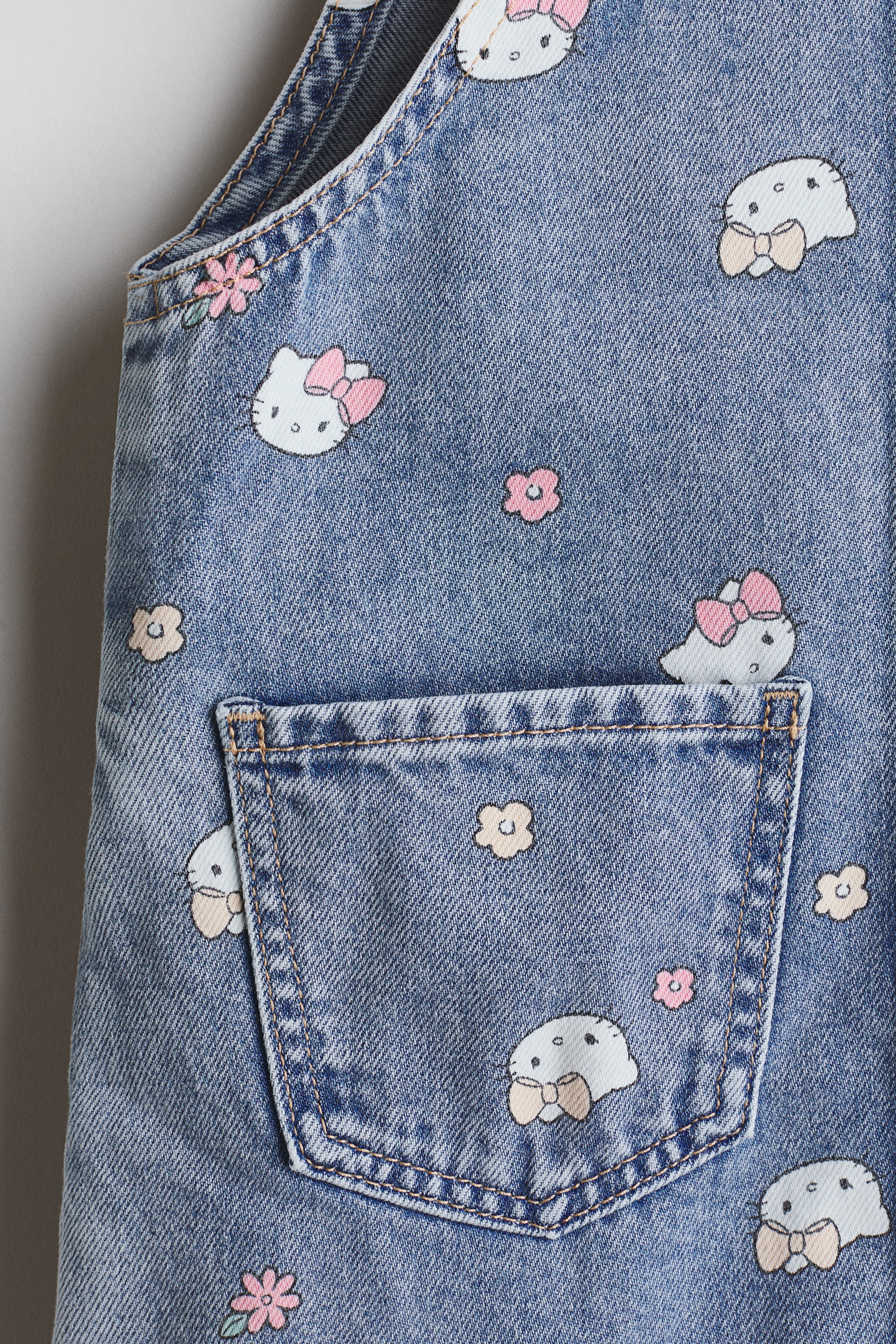 View larger image: Embroidery-Motif Overall Dress - Denim blue/Hello Kitty - Kids | H&M US 2