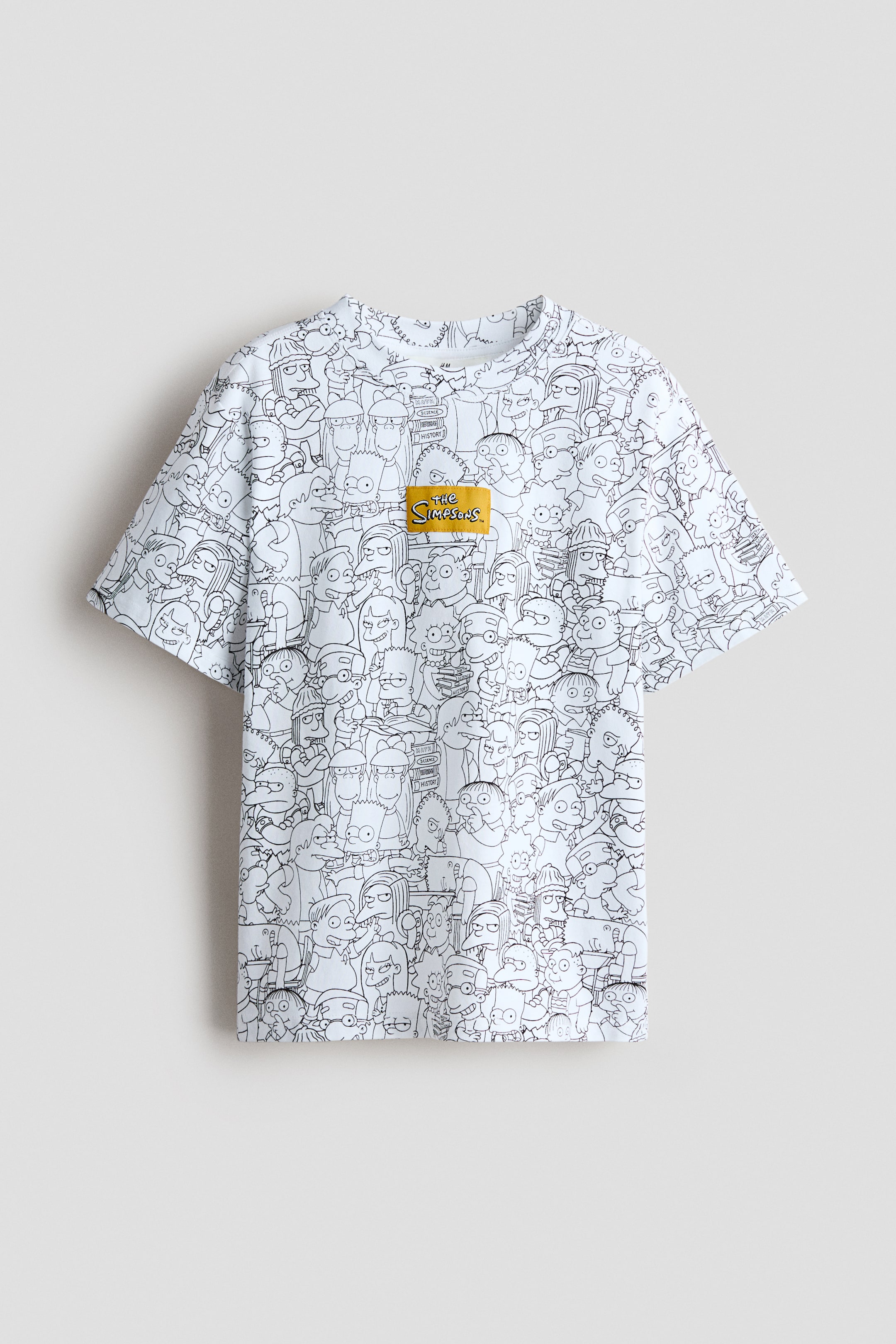 View larger image: A cotton jersey t-shirt is showcasing its front, featuring an all-over black outline print depicting "The Simpsons" characters. It is crafted with a round, ribbed neckline, short sleeves, a straight-cut hem, and a yellow "The Simpsons" logo patch is visible on the upper left chest.