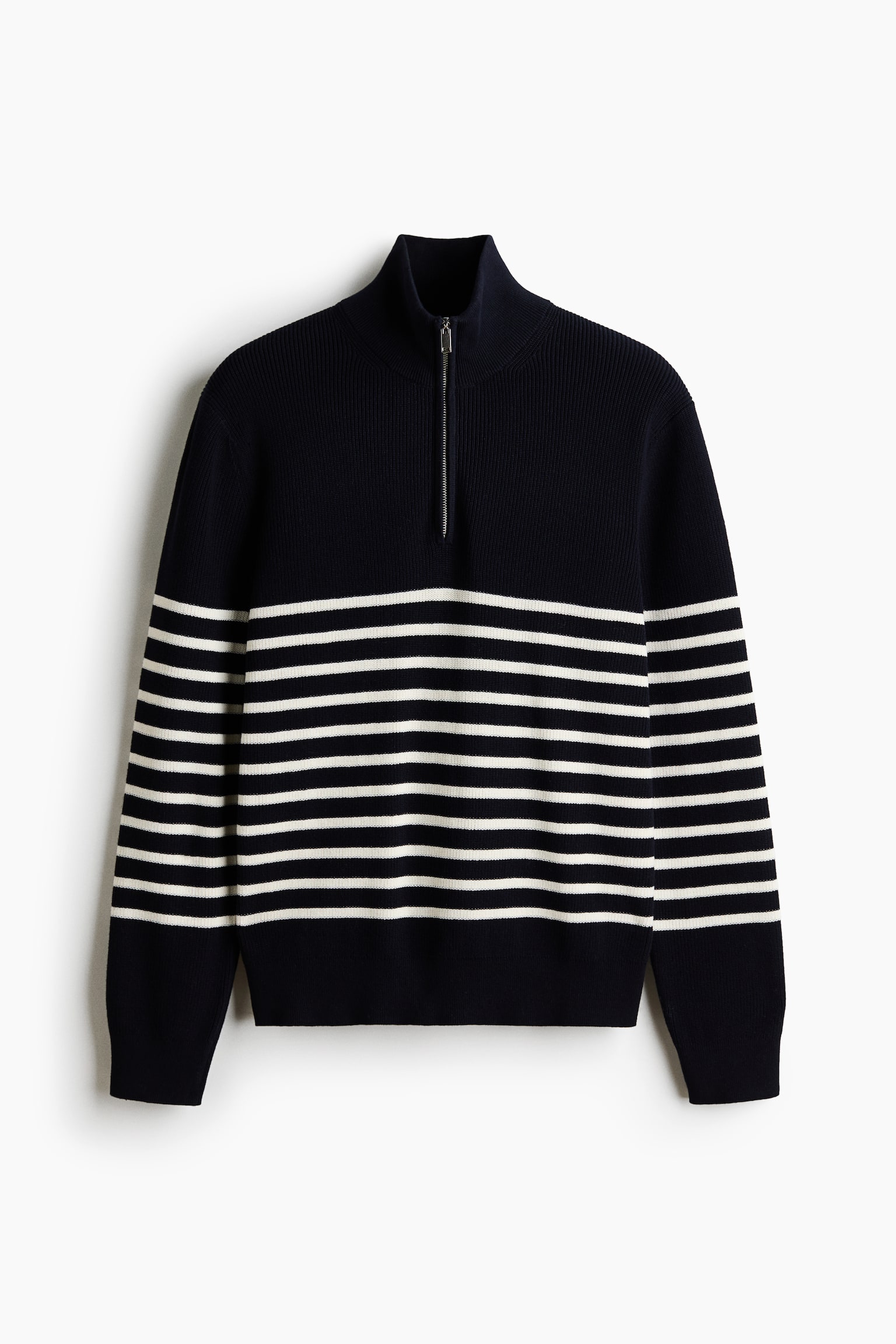 The navy blue sweater showcases white horizontal stripes running across the body and sleeves. It features a ribbed high stand-up collar with a silver-toned quarter-zip closure, complemented by ribbed cuffs and a ribbed hem.