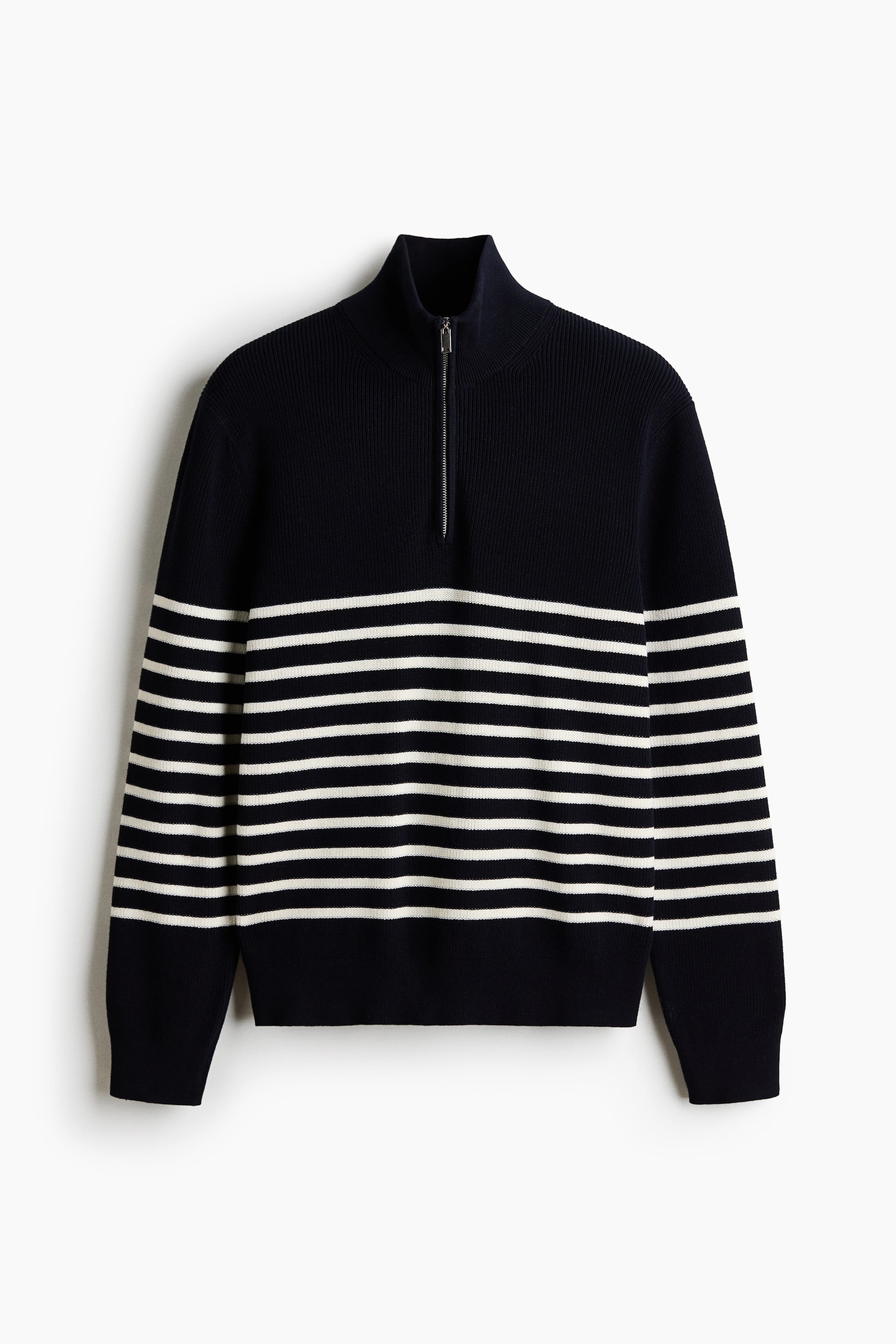 View larger image: A navy blue jumper featuring white horizontal stripes across the body and sleeves. It showcases a ribbed high stand-up collar with a silver-toned quarter-zip closure, complemented by ribbed cuffs and a ribbed hem.