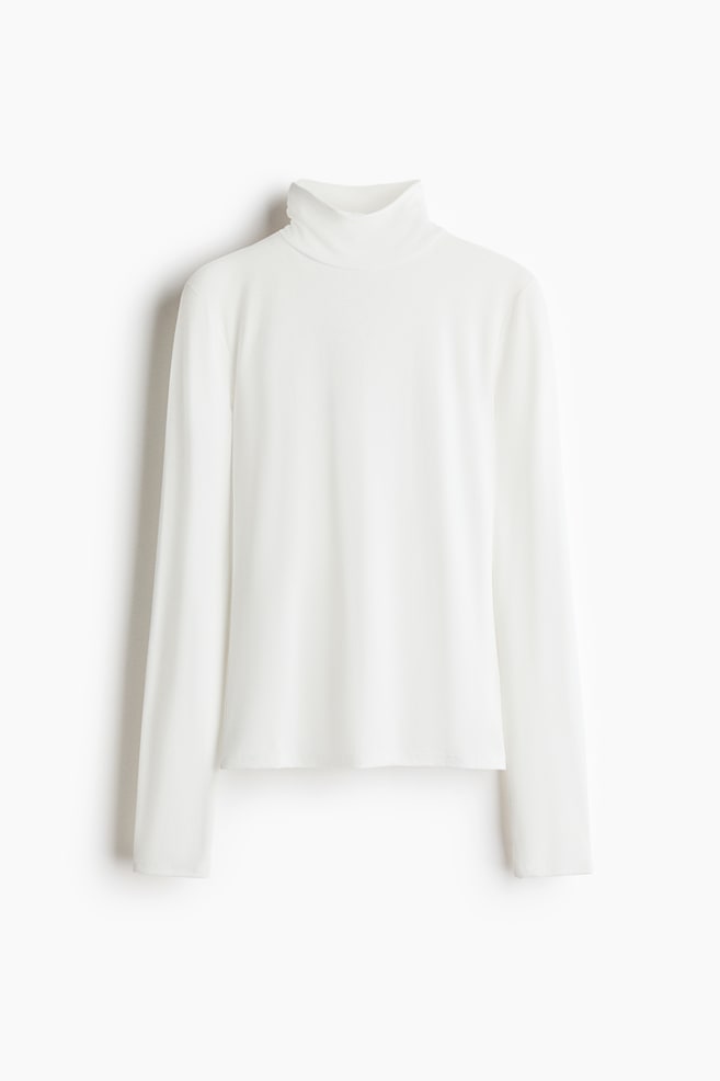 A white, rib-knit roll-neck top is shown from the front, featuring long sleeves and a straight hem. - 1