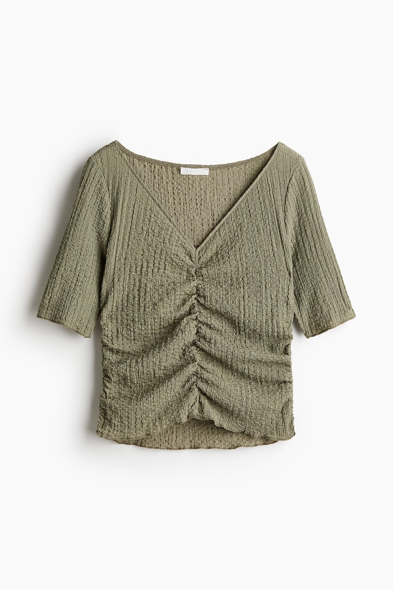 Drapirana bluza od reljefnog materijala