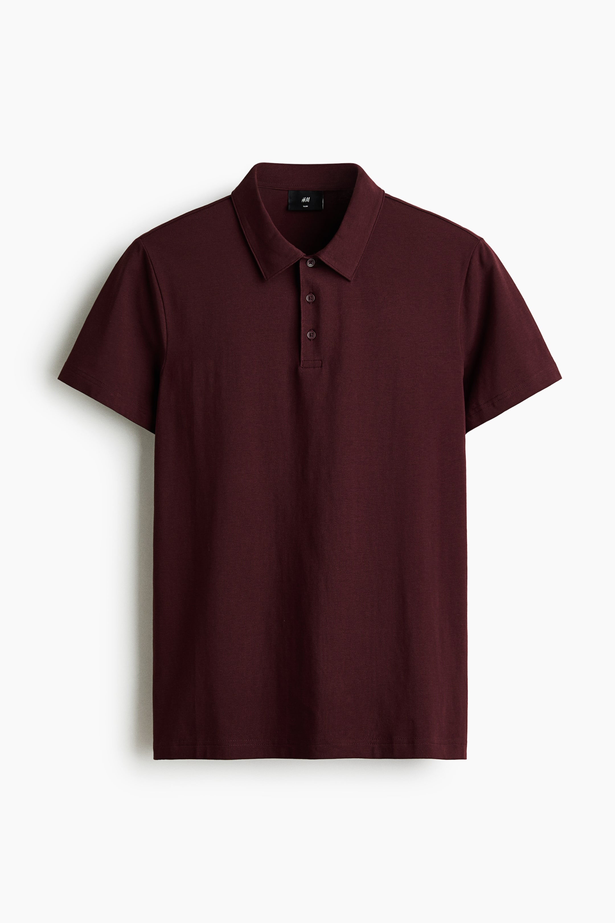 View larger image: A maroon polo shirt is shown front-facing, featuring a pointed collar, a three-button placket with dark buttons, short sleeves, and a smooth knit fabric.