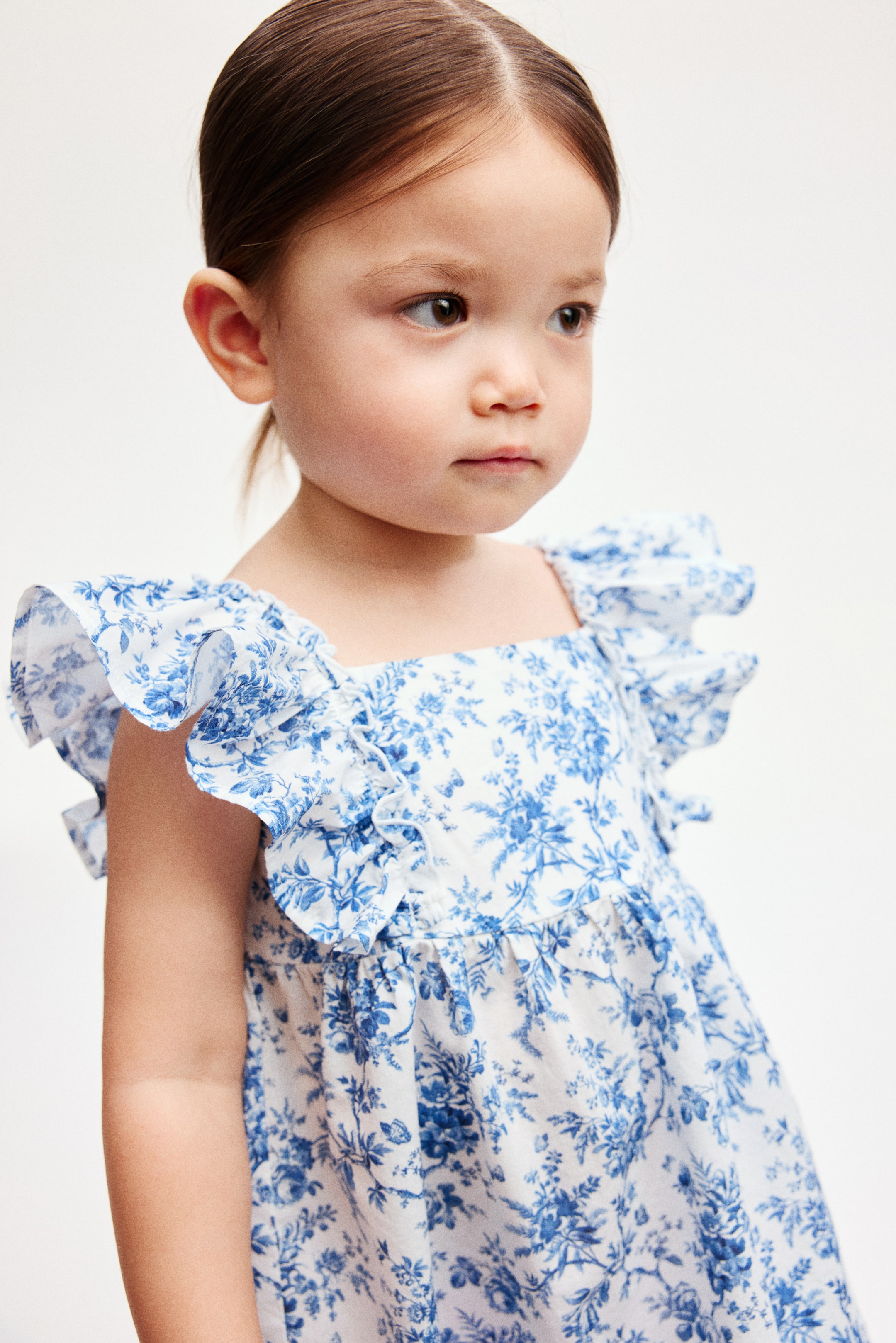 הצגת תמונה גדולה יותר: Empire-line cotton dress - כחול/פרחוני - Kids | H&M IL 1