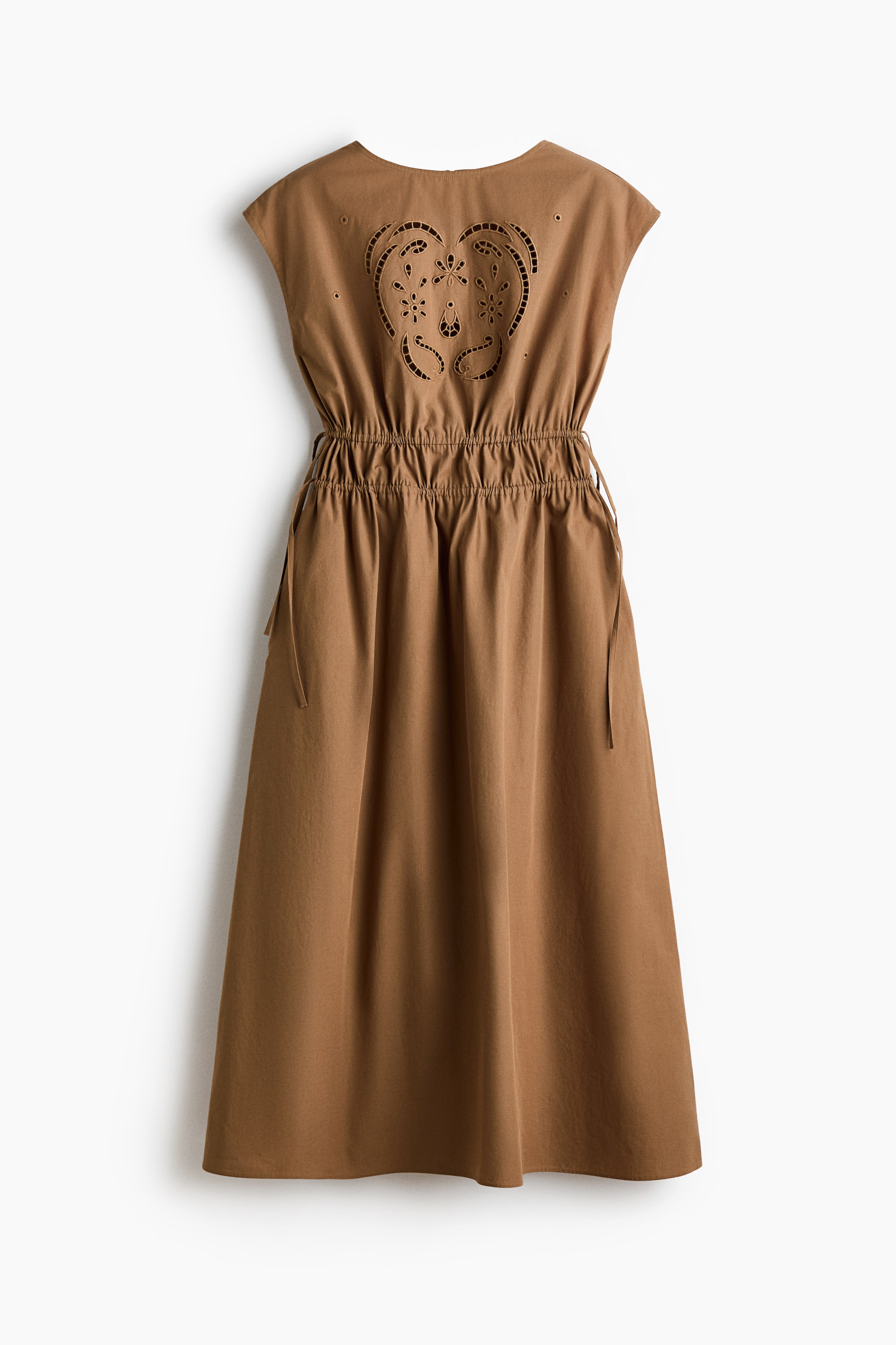 View larger image: The image showcases a brown dress viewed from the back, highlighting a prominent heart-shaped cut-out adorned with detailed floral motifs on the upper back. The dress features cap sleeves and an elasticized drawstring waist, cascading into a graceful midi skirt.