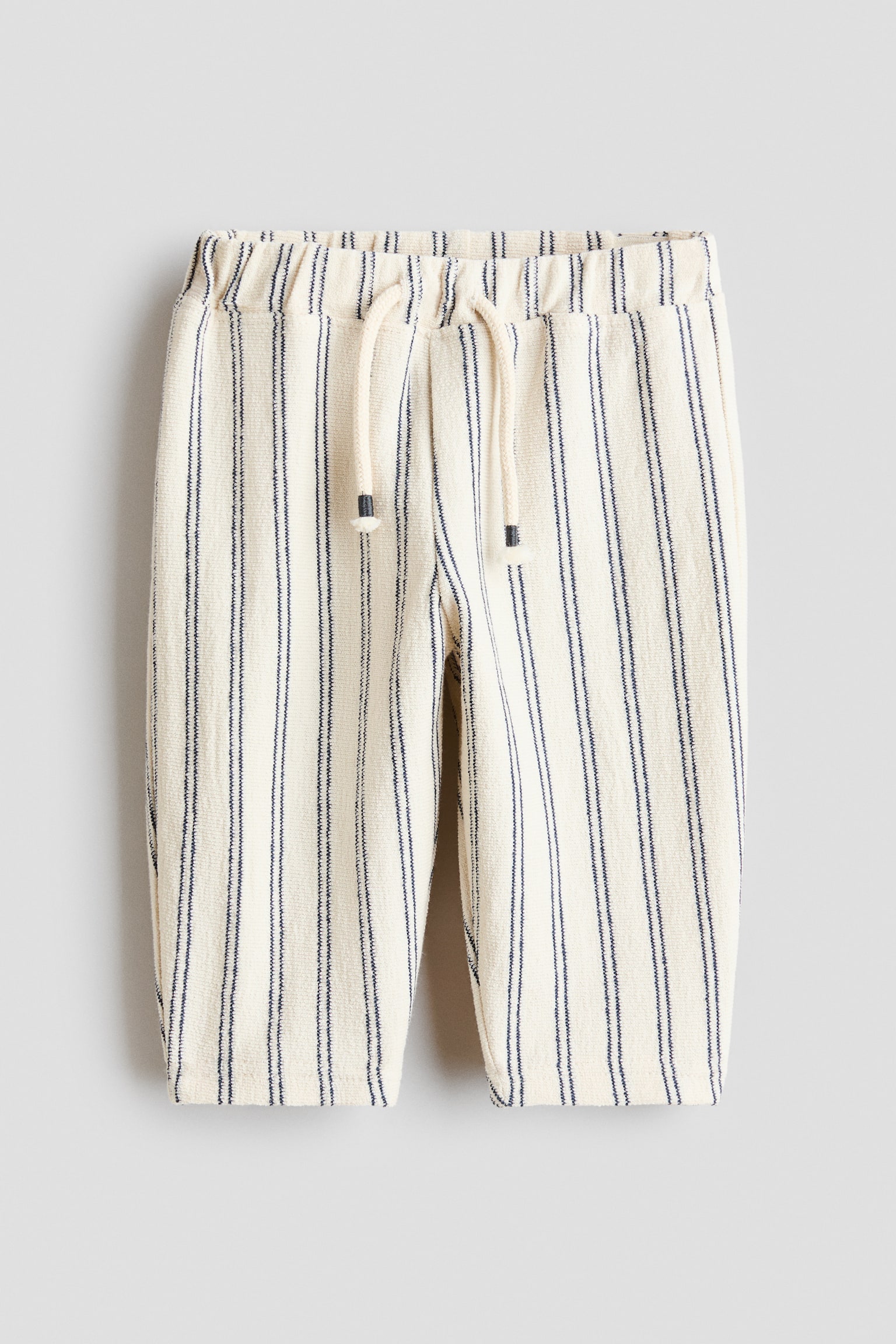 מכנסי ג'רזי עם טקסטורה - קרם/כחול כהה פסים - 1