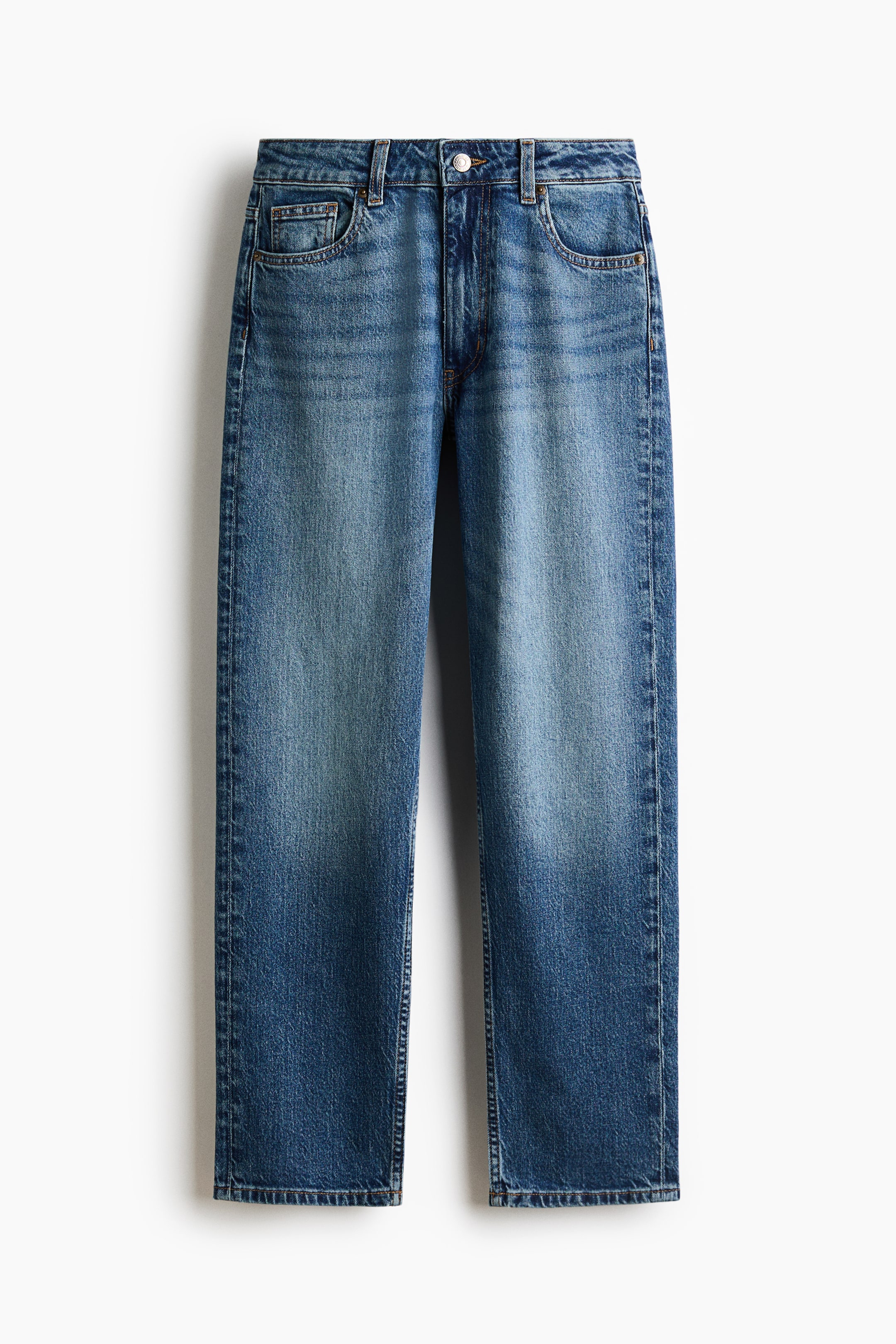 View larger image: These high-waisted, five-pocket denim jeans are hanging front-facing, showcasing a medium blue wash with faded detailing along the thighs. The jeans feature a zip fly with button closure, belt loops, and straight legs that taper slightly toward the hem.