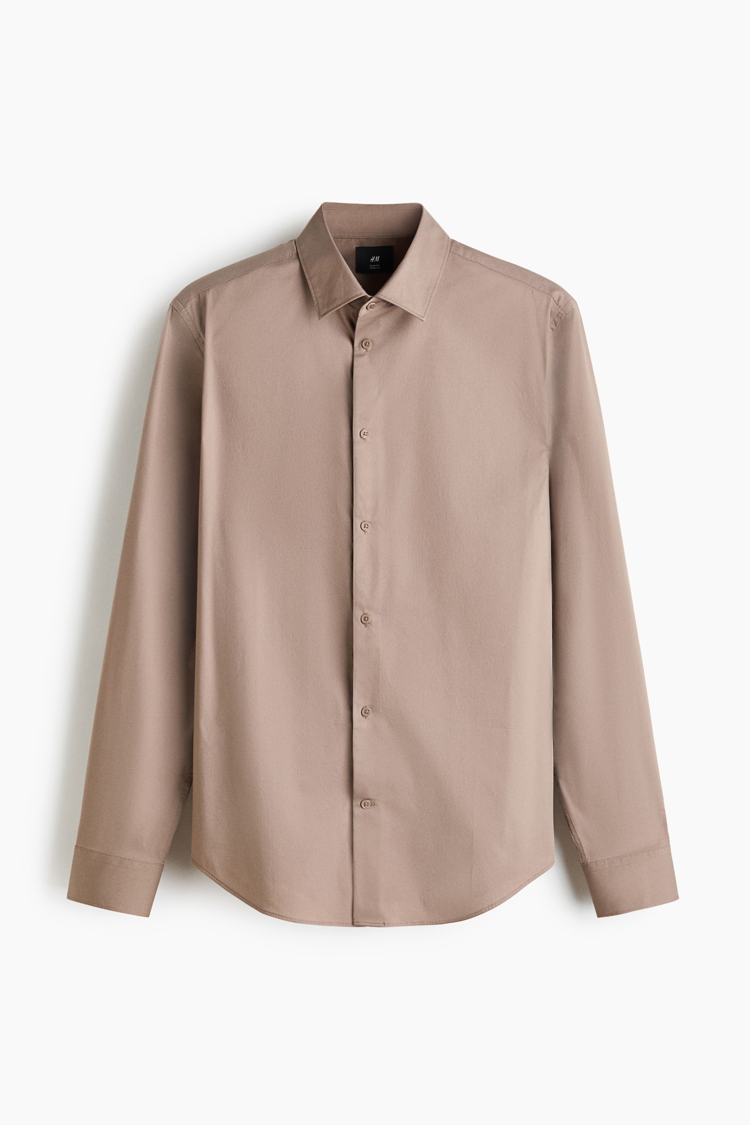 A taupe slim-fit shirt is displayed from the front, featuring a cutaway collar and a French placket. It showcases long sleeves with adjustable buttoned cuffs, a small button on the sleeve placket, and a gently rounded hem. - 1